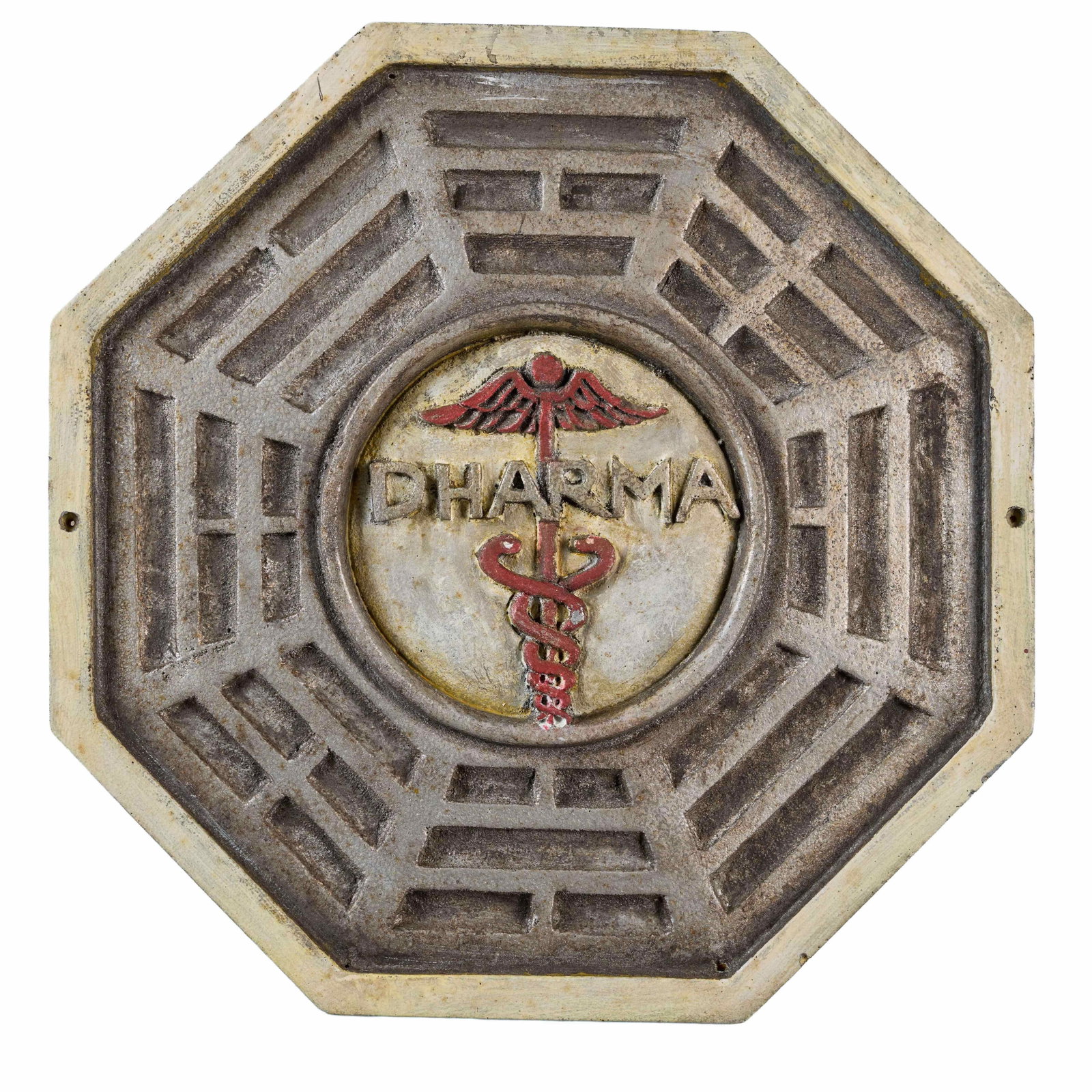 Lost | Dharma Initiative "The Staff Station" Wall Insignia (with Magazine): The Dharma Initiative wall insignia for "The Staff" from the production of the sci-fi thriller series Lost (ABC, 2004 - 2010). The sign is composed of carved, hand-painted hard foam. It