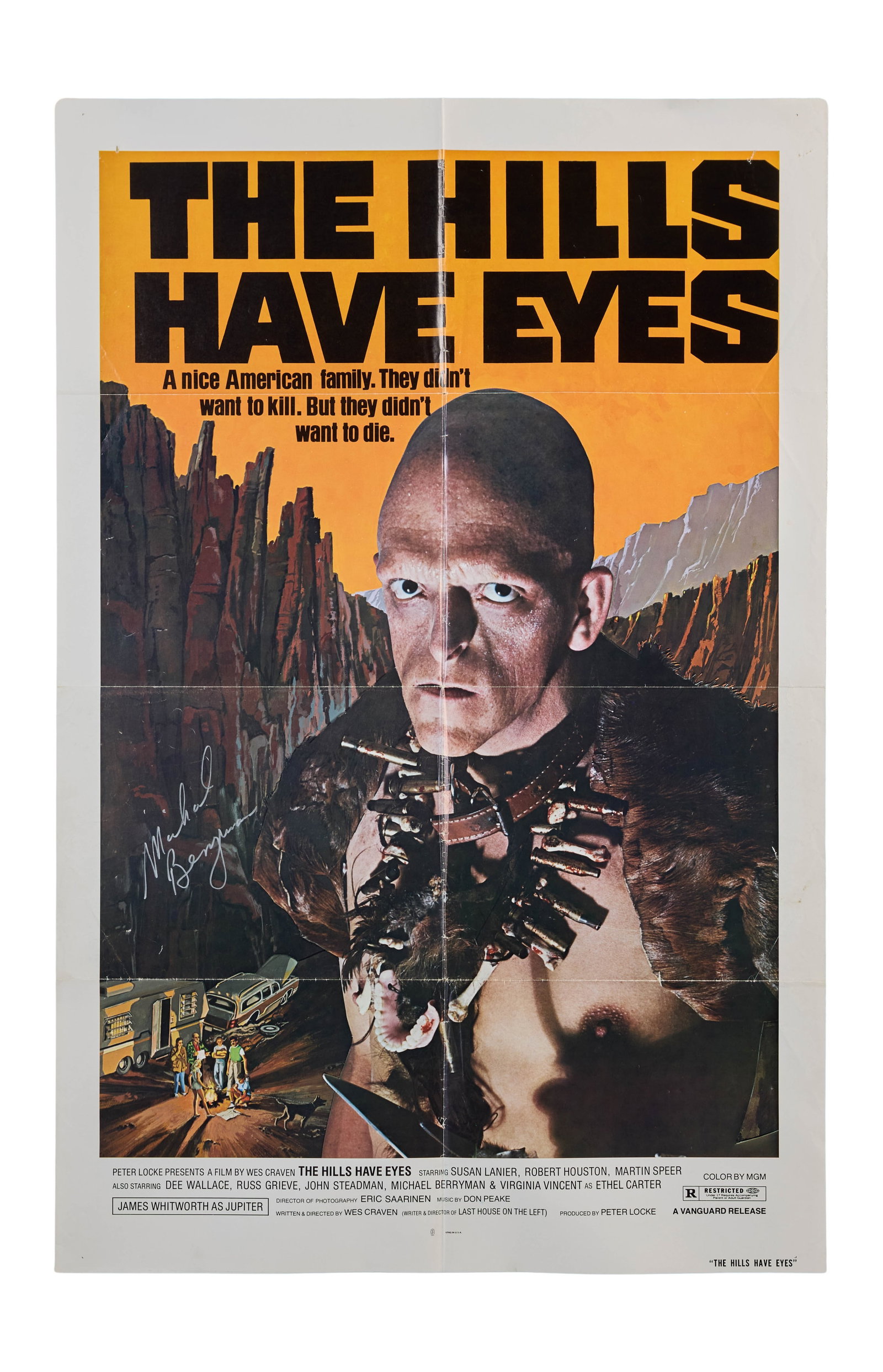 The Hills Have Eyes | Michael Berryman Signed Poster: Vanguard, 1977. One-sheet poster, 27 x 41 inches. Small holes on top left and top right; a small stain on the middle right; minor fold separation; some fold wear. Folded. This poster is signed by