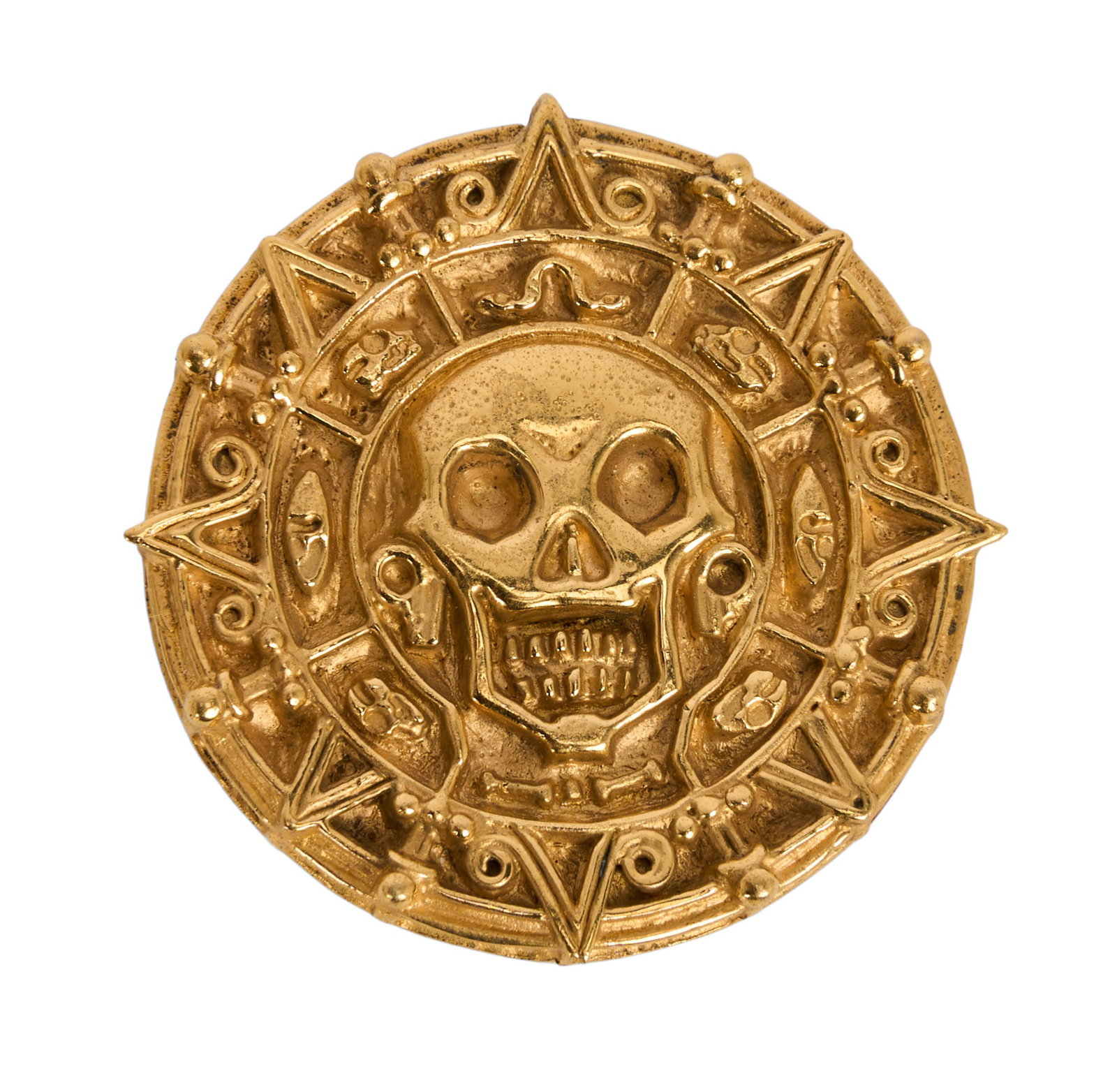 Pirates of the Caribbean: Curse of the Black Pearl | Aztec Coin Prop: An Aztec coin prop from the production of Pirates of the Caribbean: The Curse of the Black Pearl (Buena Vista Pictures Distribution, 2003), directed by Gore Verbinski. The gold-tone coin is
