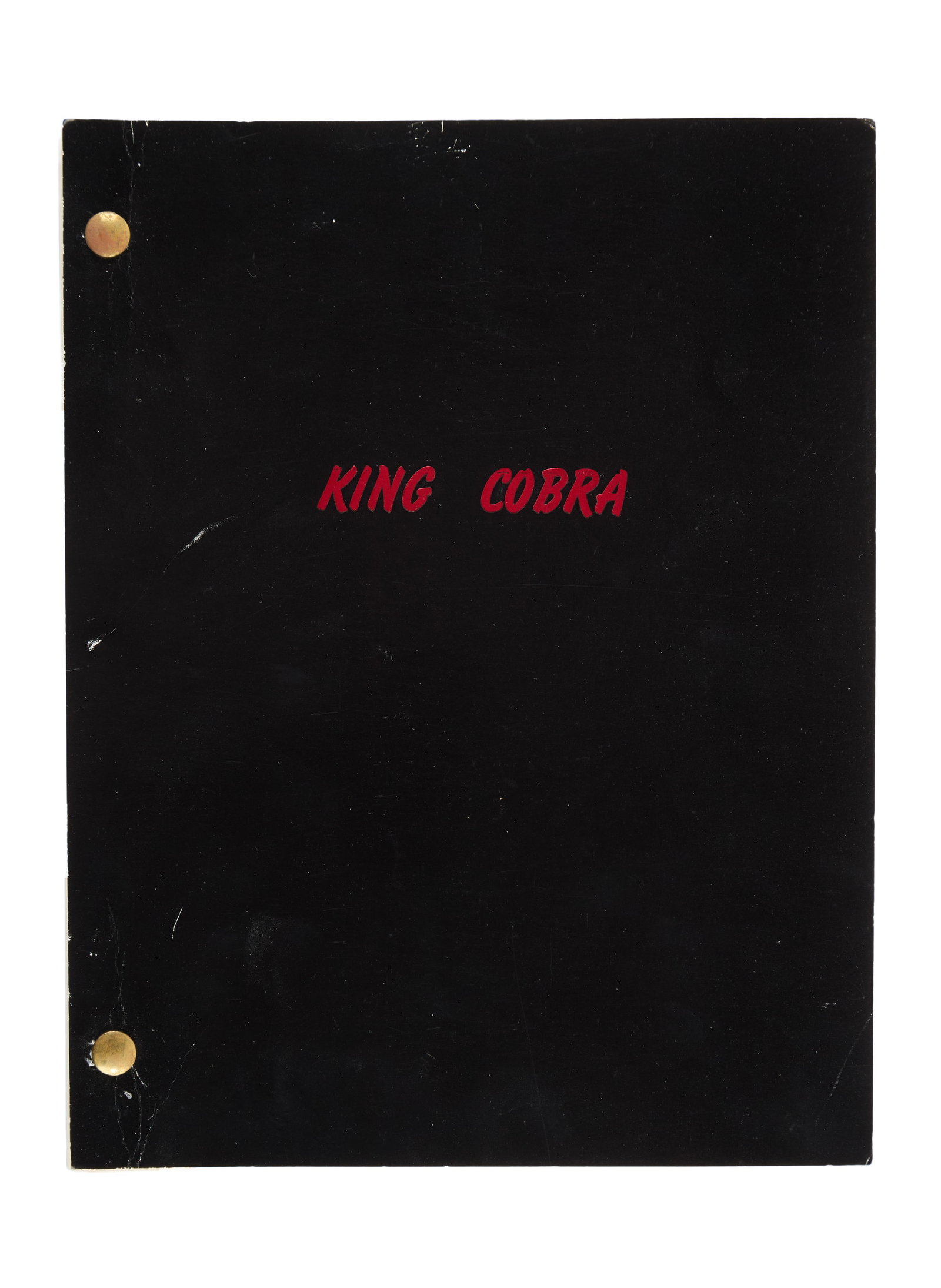 Cobra | "King Cobra" Production Script: An original production script for Cobra (Warner Bros., 1986), the action thriller written by and starring Sylvester Stallone, based on the 1974 novel "Fair Game" by Paula Gosling. Using the working