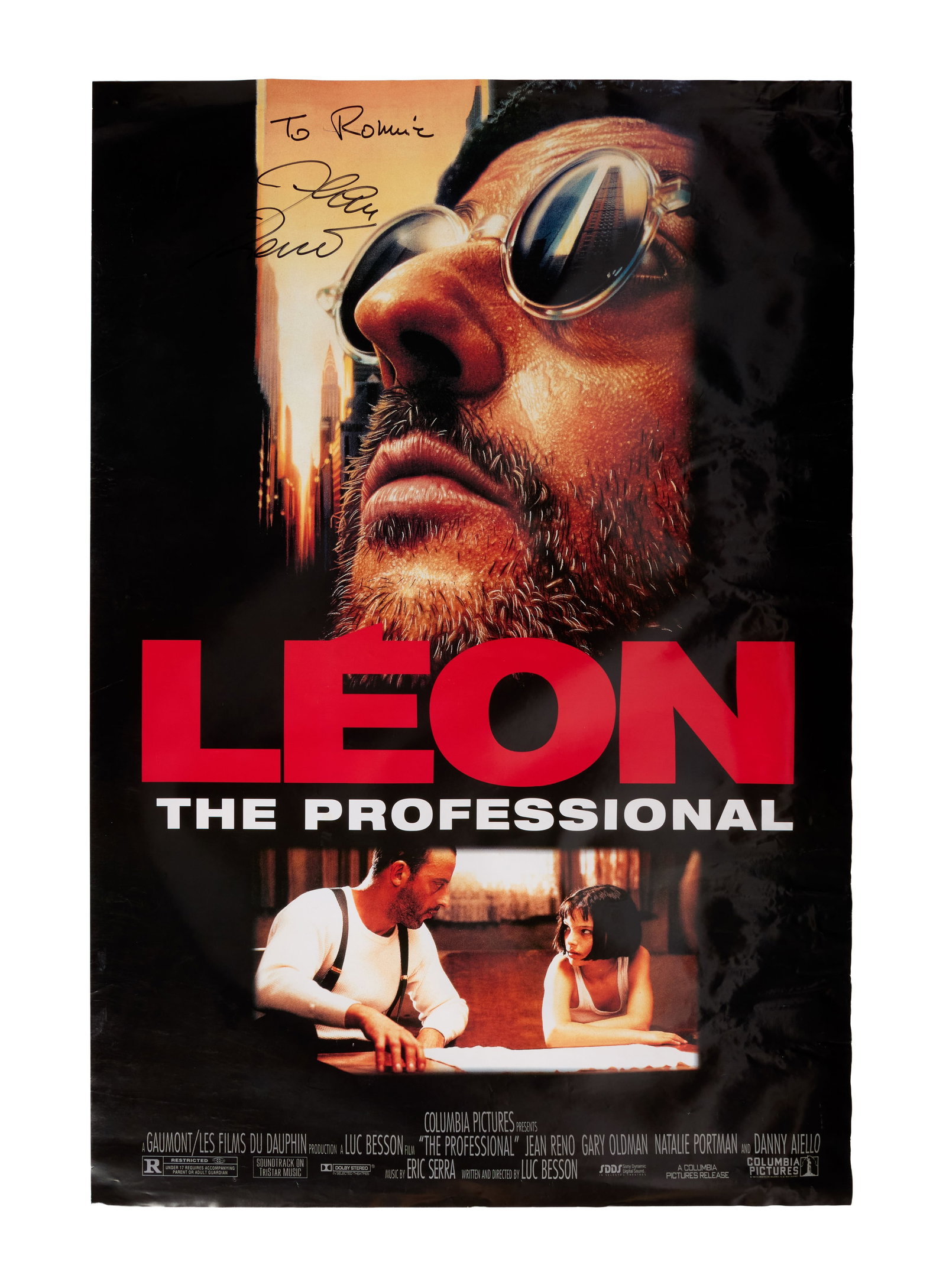 Leon: The Professional | Jean Reno Signed Poster: A one-sheet poster for Léon: The Professional (Columbia Pictures, 1994) signed and inscribed by Jean Reno, who plays the title character. Columbia Pictures, 1994. One-sheet poster, 26.5 x 39.5