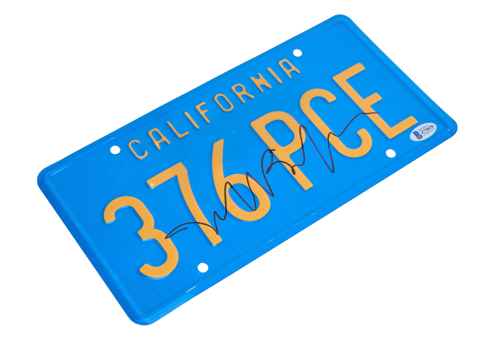 The Big Lebowski | Jeff Bridges Signed License Plate: A production-used license plate that adorned Jeffrey "The Dude" Lebowski's Ford Gran Torino in The Big Lebowski (Working Title Films, 1998). The license plate has been signed by the star of the film