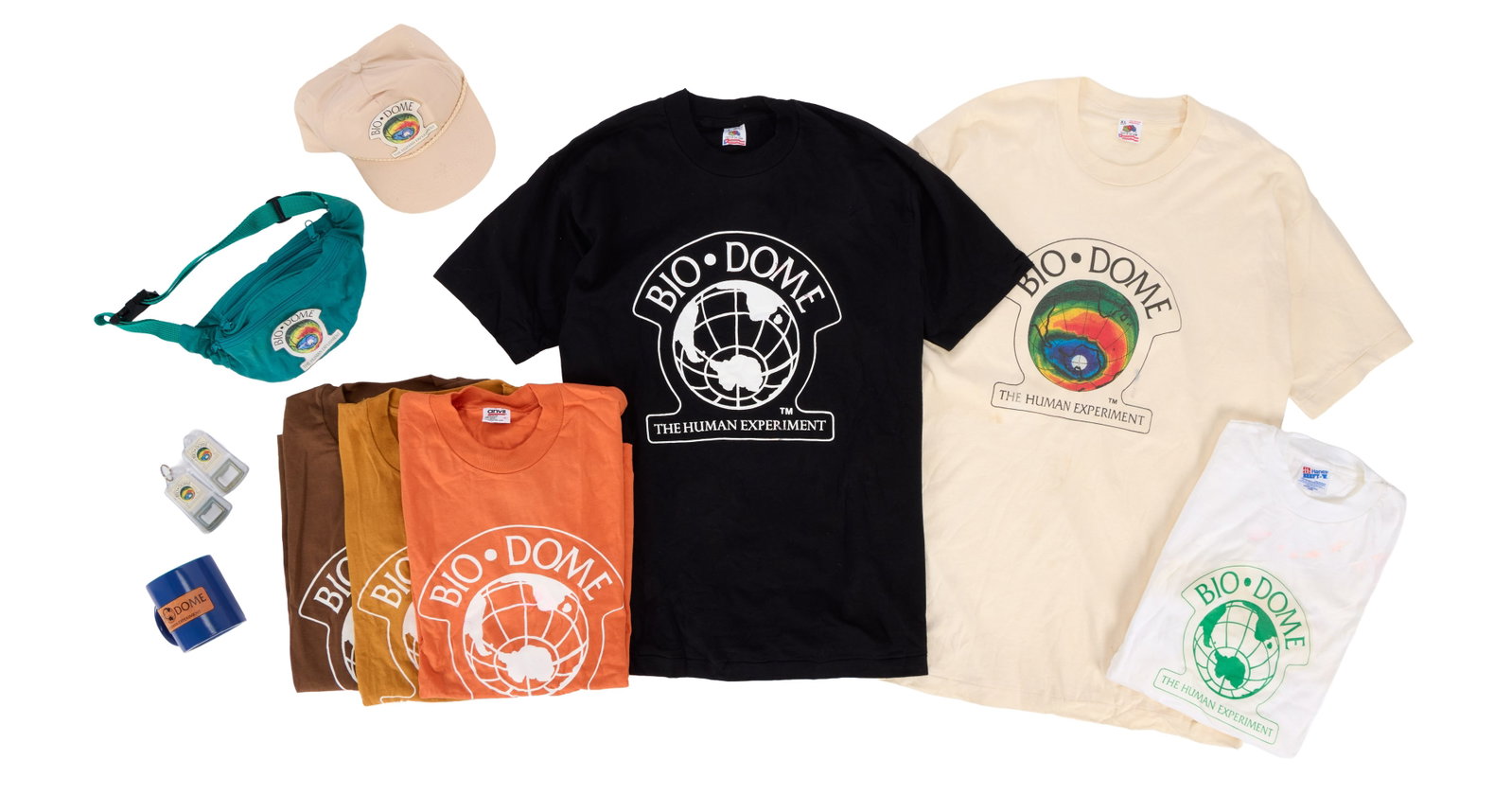 Bio-Dome | Production-Made "Bio-Dome" Shirts and Merchandise: A collection of 11 custom-made items from the production of the Pauly Shore and Stephen Baldwin-starring comedy Bio-Dome (MGM/UA, 1996). The items are all merchandise being sold at a stall outside of