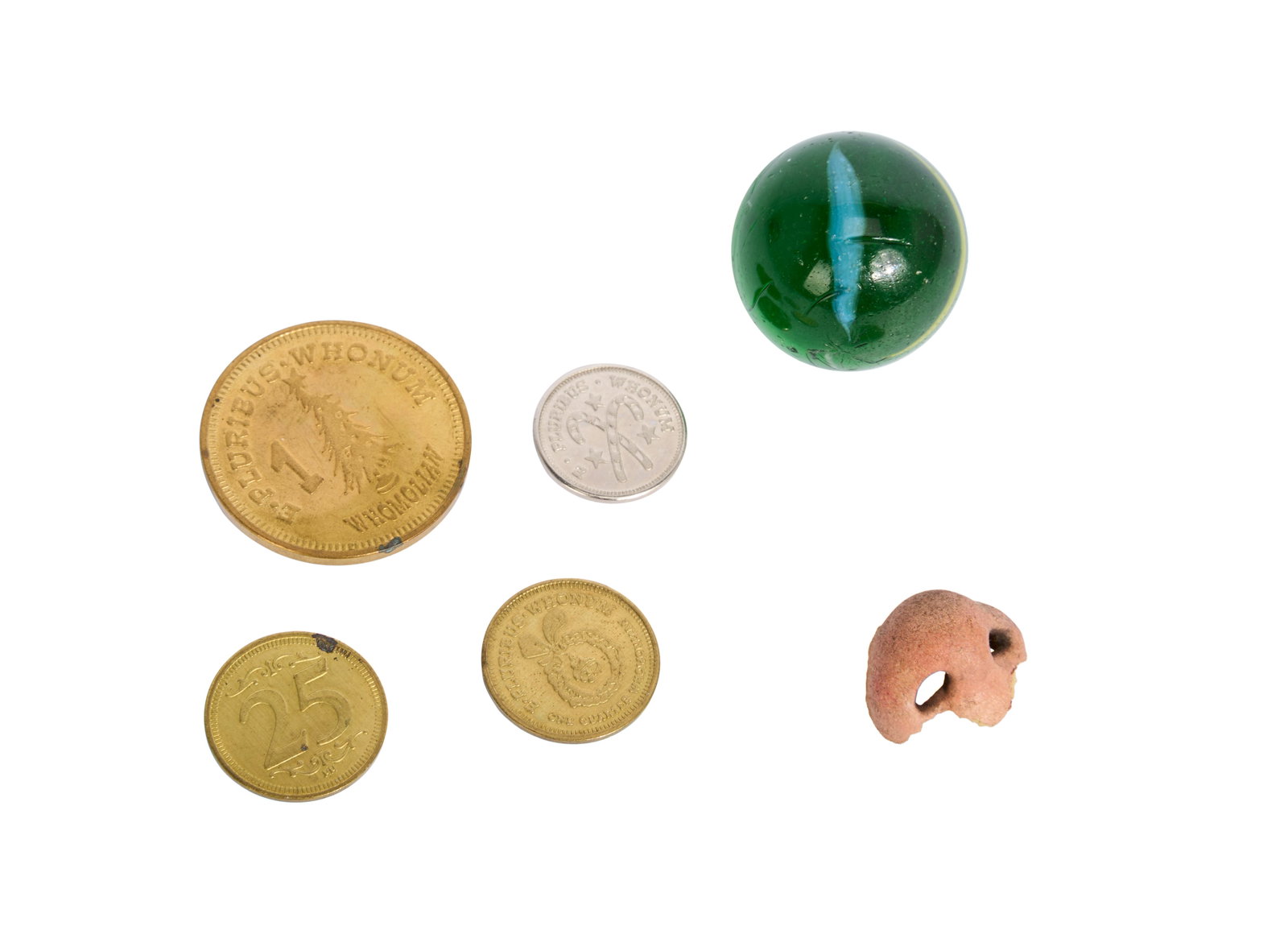 How the Grinch Stole Christmas | Who Nose Prosthetic, Whoville Coins (x4), and Grinch Prank Marble: A group of props from the production of the Ron Howard directed film, How the Grinch Stole Christmas (Universal Pictures, 2000), including: - A green marble the Grinch uses to wreak havoc on Whoville