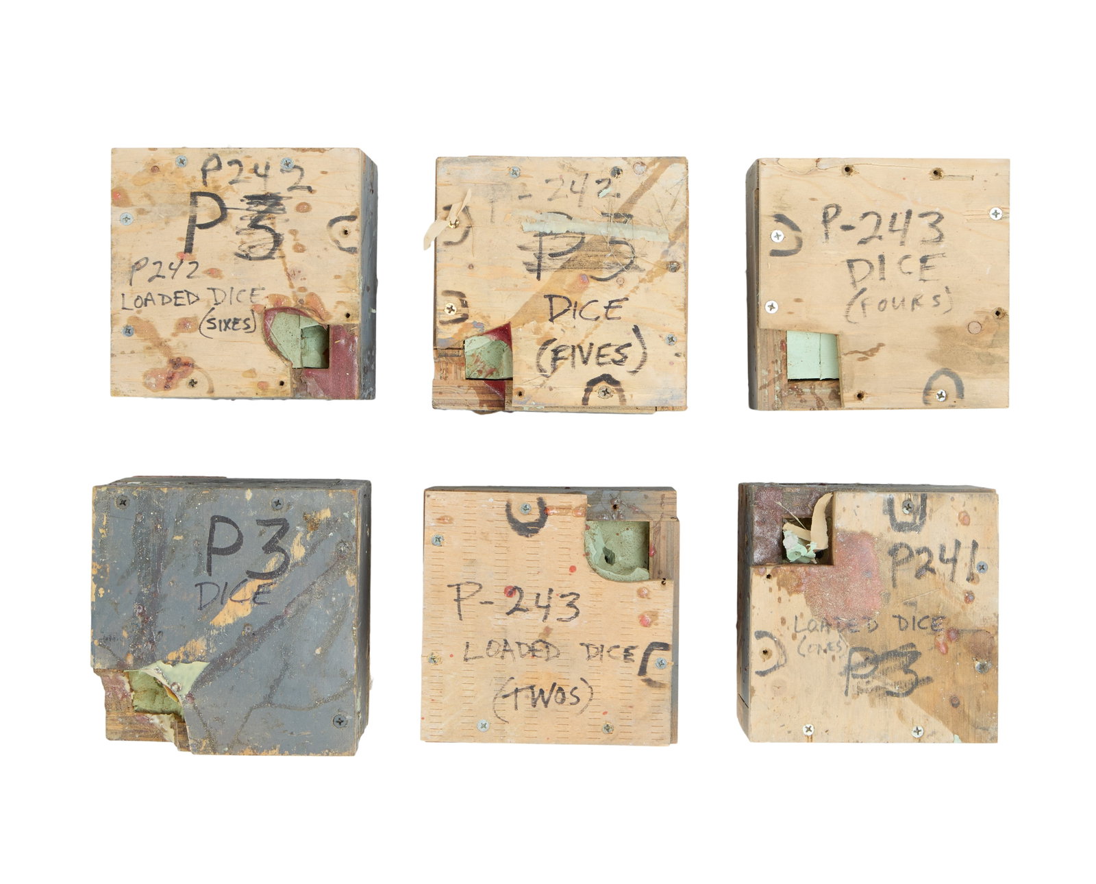 The Flintstones in Viva Rock Vegas | Loaded Dice Molds: Six silicone molds for casino loaded dice from the production of the prehistoric prequel The Flintstones in Viva Rock Vegas (Universal, 2000). Each mold is housed in a wooden cube and indicated with