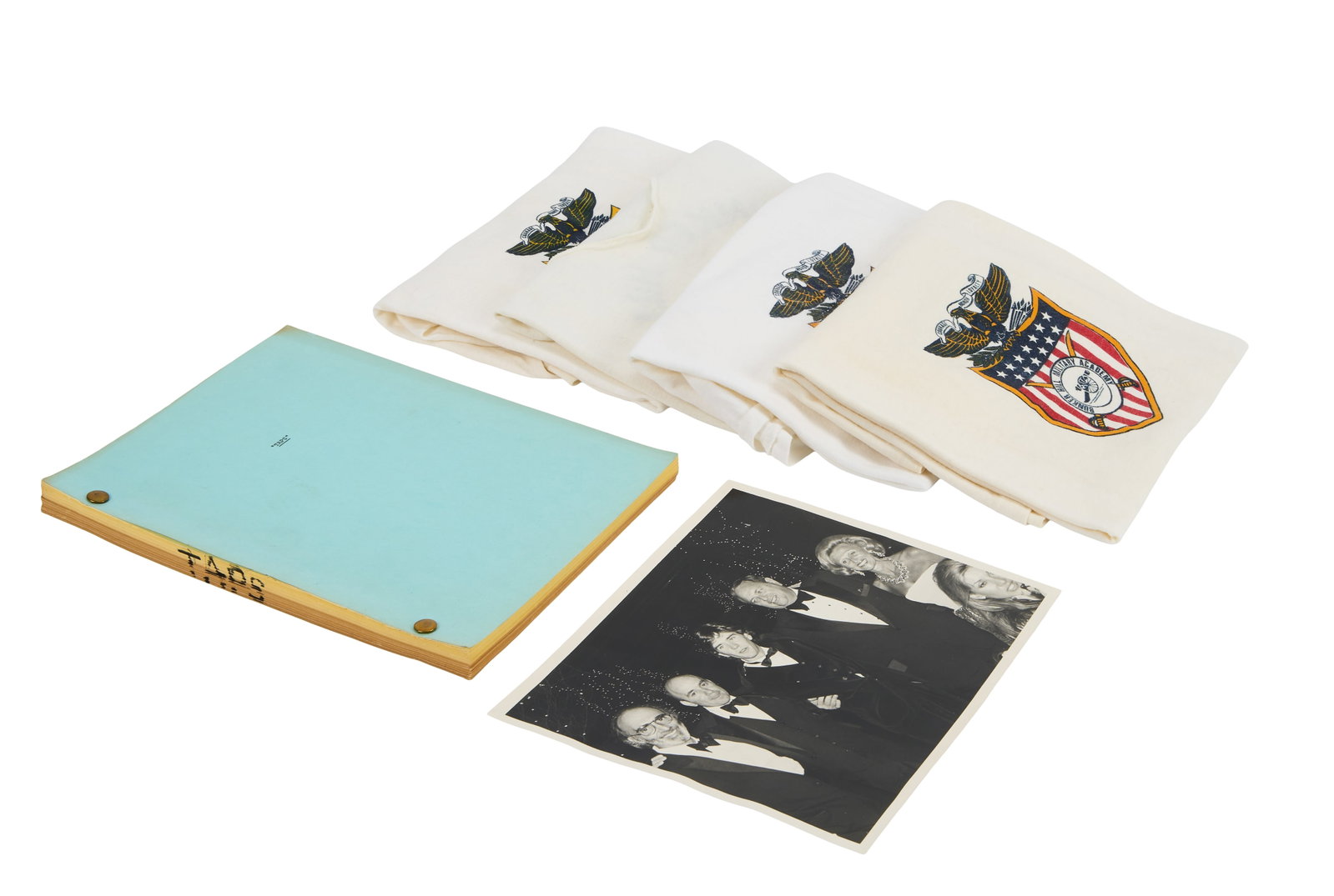 Taps | Production Script with Crew Shirts: An original script from the production of the military academy drama Taps (20th Century Fox, 1981). The script is 126 pages, with a one page appendix at the back, and on yellow and tan paper. The
