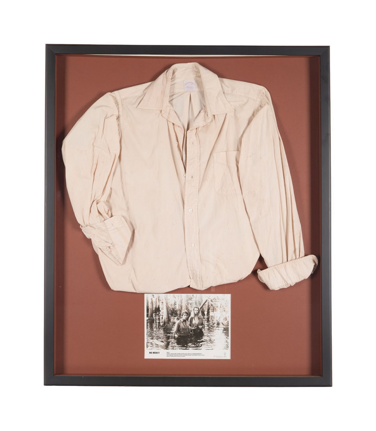 No Mercy | Eddie Jillette (Richard Gere) Shirt: A button-up shirt worn by Richard Gere in the neo-noir No Mercy (TriStar, 1986). The shirt is a cotton polo by Brooks Brothers in white worn cuffed to the elbows. The shirt has been displayed in a
