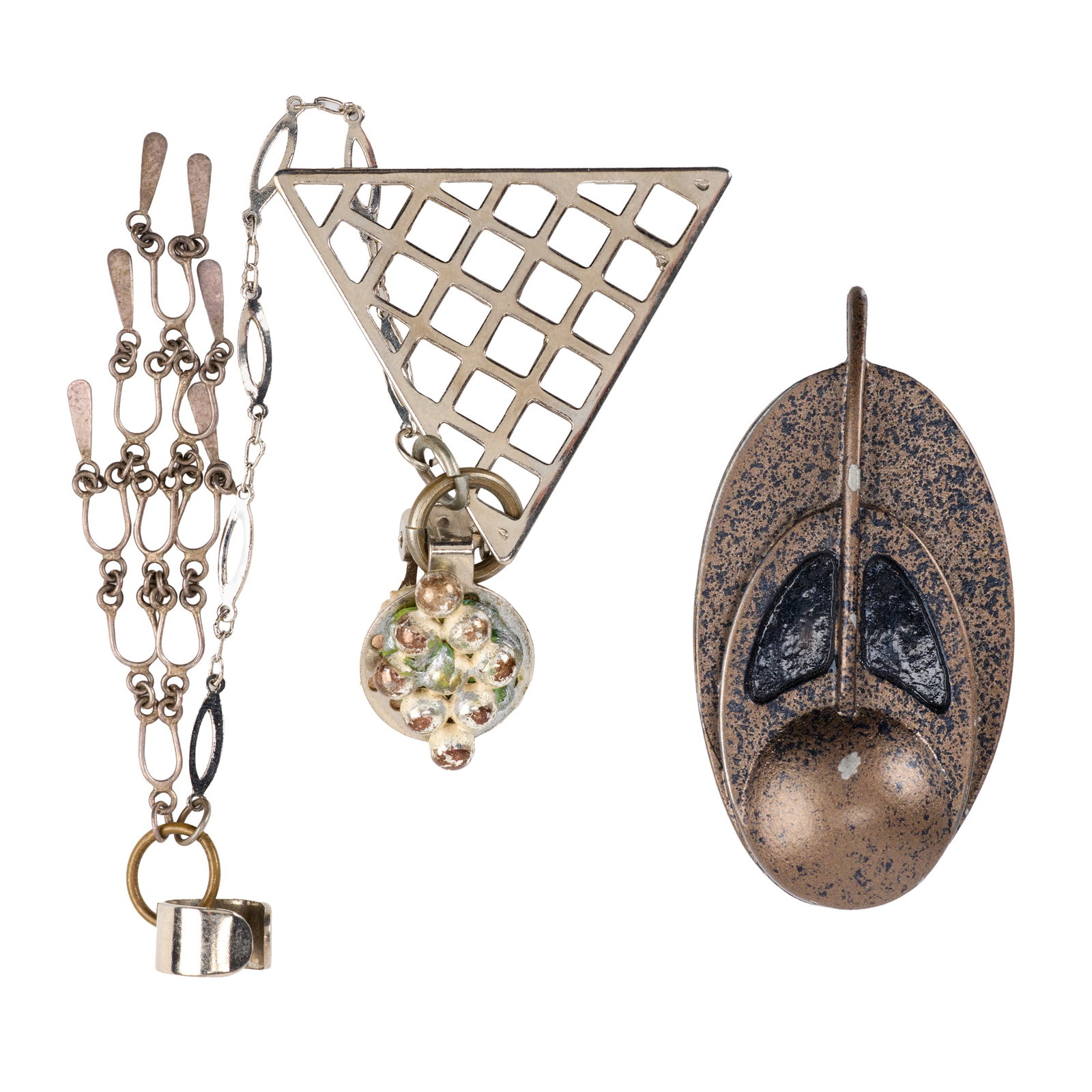 Star Trek: Deep Space Nine | Bajoran Combadge and Earring: A Bajoran combadge prop and Bajoran earring from the production of Star Trek: Deep Space Nine (Syndicated, 1993-1999). The combadge is constructed from molded metal with black and bronze-tone paint,