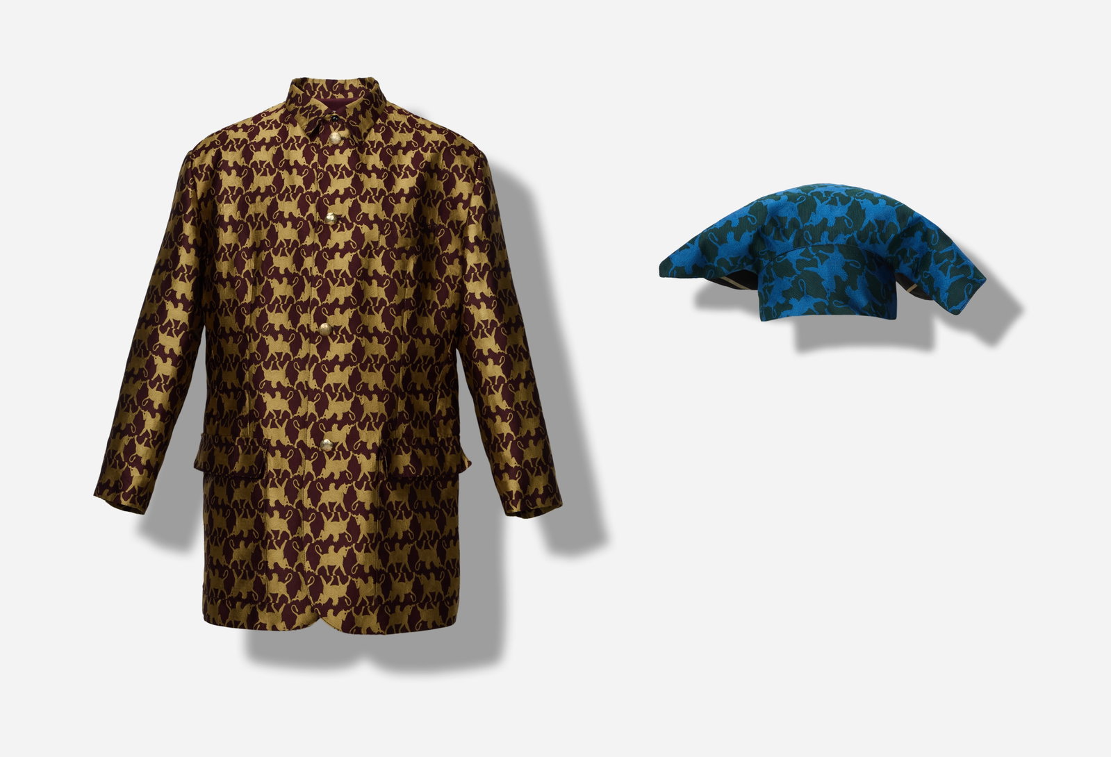 Boy George | 1984 Jean Paul Gaultier Homme Unicorn Assyrian Pattern (With Image): This a 1984 patterned brocade jacket with head-piece accessory from the collection of Boy George. The property comes with a printed image of Boy George wearing the head-piece. Boy George wore a simila