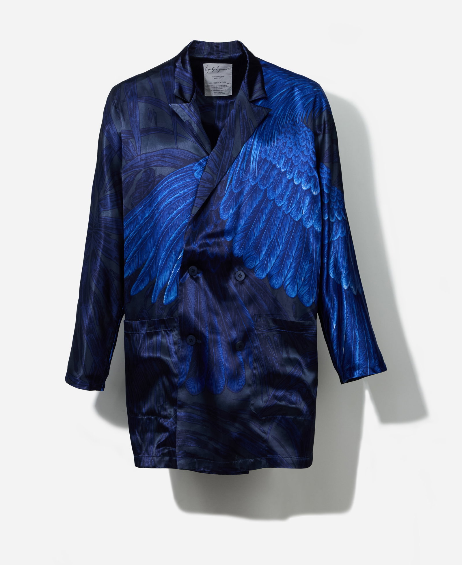 Boy George | 1985 Spring Yohji Yamamoto Coat: Yohji Yamamoto blue feather print coat from the Spring Summer 1985 Collection from the collection of Boy George. The oversized coat is composed of 100% acetate in deep blue and charcoal ton