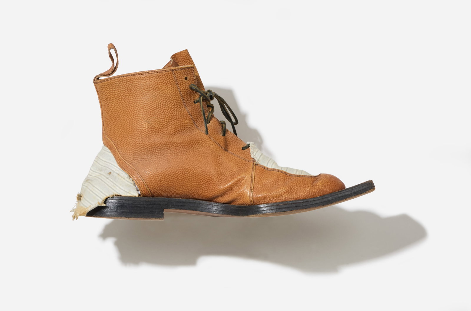 Boy George | 1985 Patrick Cox for John Galliano Fallen Angels Runway Boots: A pair of Patrick Cox boots for John Galliano 1985 Fallen Angel runway show from the collection of Boy George. A unique pair of leather lace-up ankle boots with outstretch chiseled square toe so