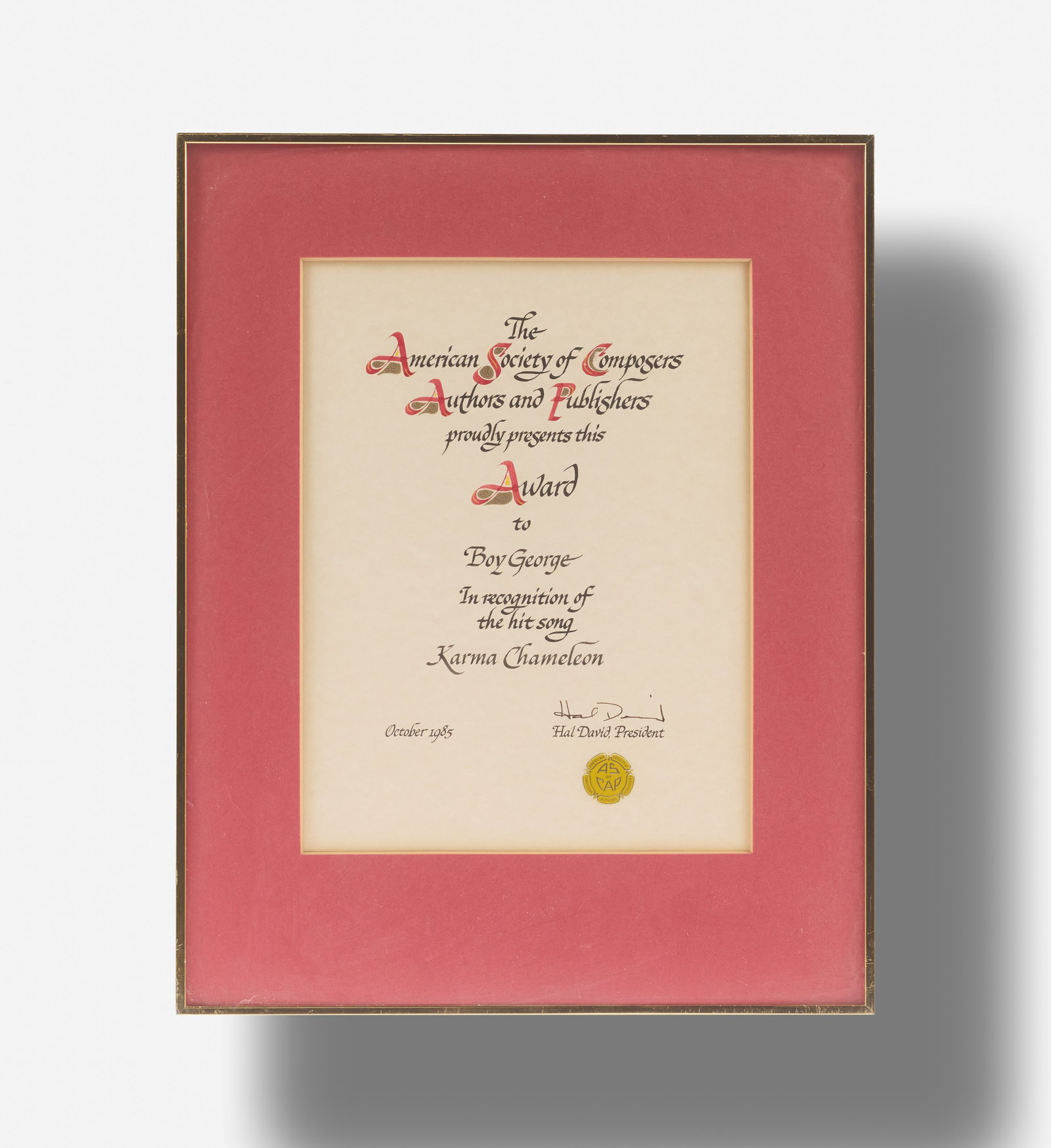 Boy George | 1985 The American Society of Composers Award for the Culture Club Single "Karma: A framed award certificate presented to Boy George in October of 1985, from The American Society of Composers, Authors, and Publishers, in recognition of Culture Club's hit song "Karma Chameleon." Sig