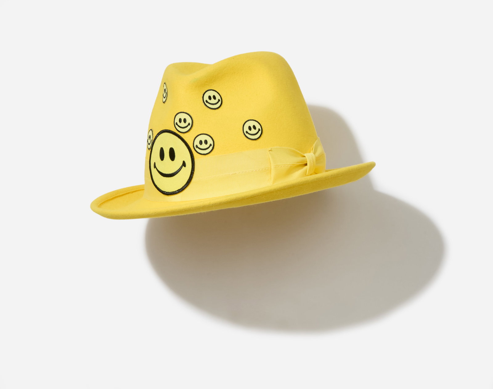 Boy George | 2017 Performance Worn A Child of the Jago Yellow Smiley Face Hat (With Image): A Child of the Jago yellow fedora from the collection of Boy George. This hat was worn by Boy George for a Dean Stockings photo-portrait which wore with a matching smiley-face patterned shirt. He wore