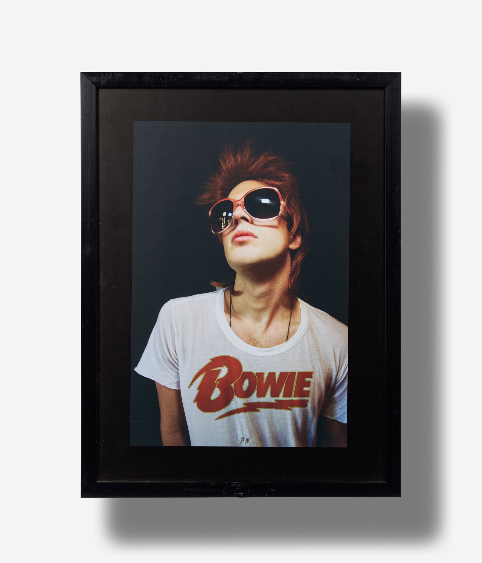 Boy George | Boy George Photograph from the David Bowie Wig Series: A color photograph of a model wearing a David Bowie wig, sunglasses, and "Bowie" T-Shirt. By George O'Dowd (British, B. 1961). Image size 16 x 10.5 inches. Boy George has cited David Bowie as his main