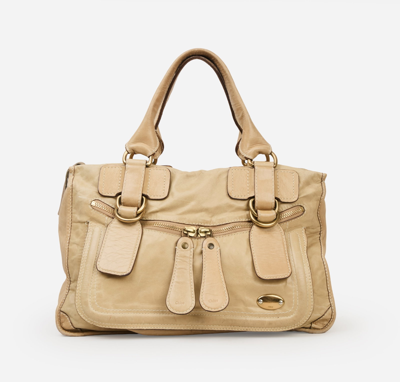 Chloé | 2000s Phoebe Philo Beige Leather Bay Tote Bag: Chloé beige leather Bay tote bag designed in the mid-2000s by Phoebe Philo for Chloé. The bag is composed of lambskin leather with a ribbed, pleated front, a Chloé logo plaque on