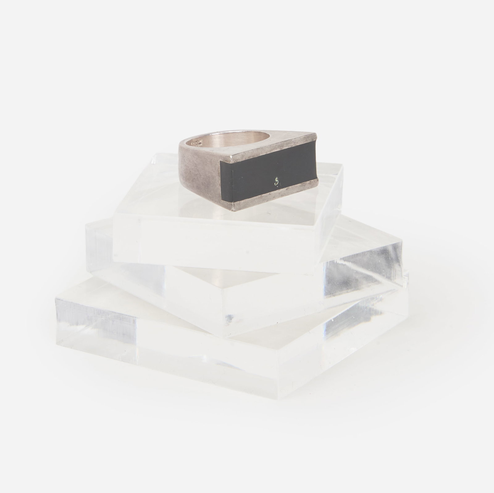 Gucci | Tom Ford Ring: Gucci by Tom Ford ring is set with a rectangular black rubber inlay, to sterling silver mounting. It weighs 15.8 grams and is a size 7.5. Marked "925" with Italian marks and "Made in Italy." Tom Ford'