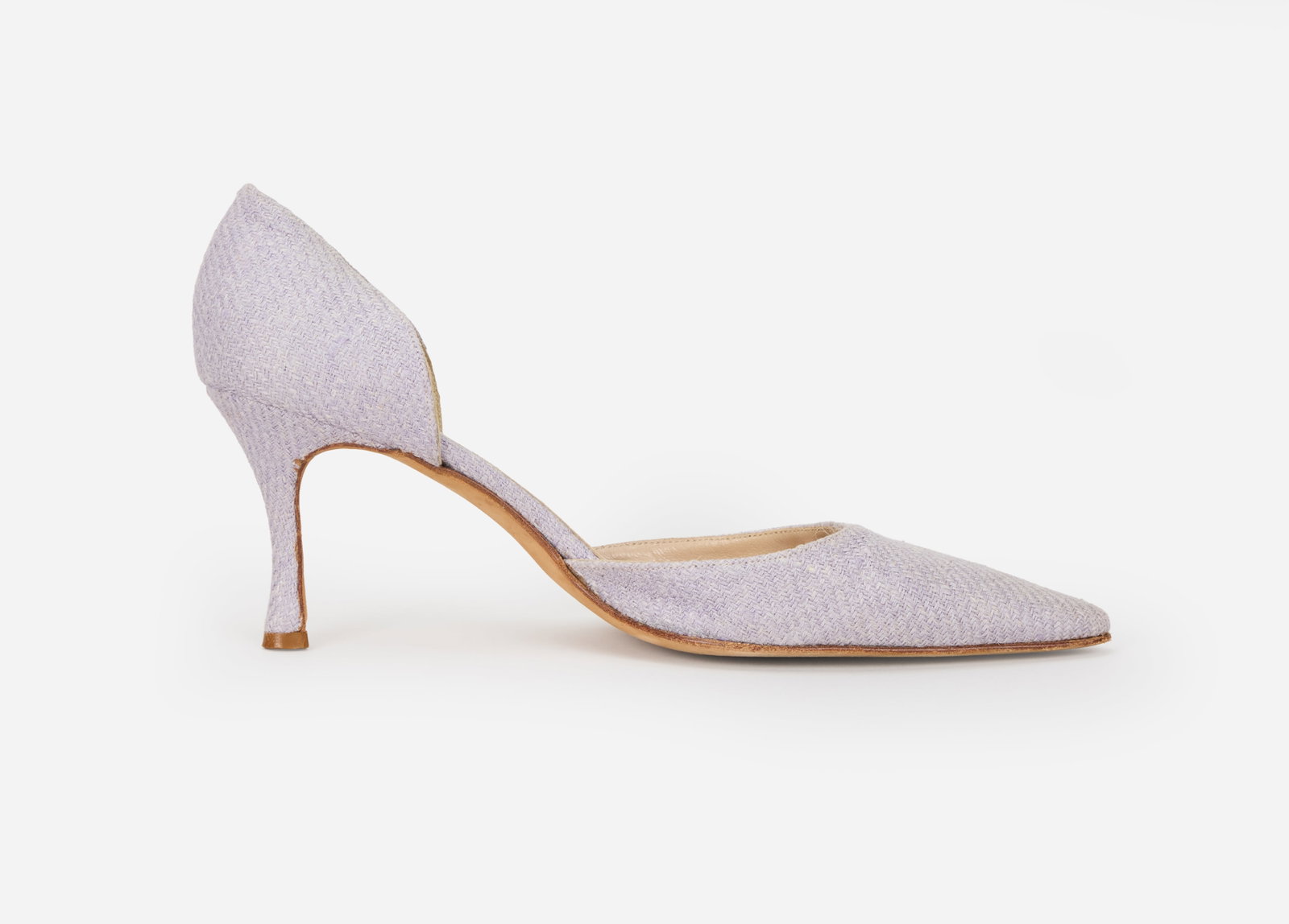 Manolo Blahnik | Lavender Tweed D'Orsay Pumps: A pair of lavender tweed Dorsey style heels design by Manolo Blahnik. The fabric heels feature beige leather in soles with a Manolo Blahnik label with beige suede outer soles. The shoes are marked a