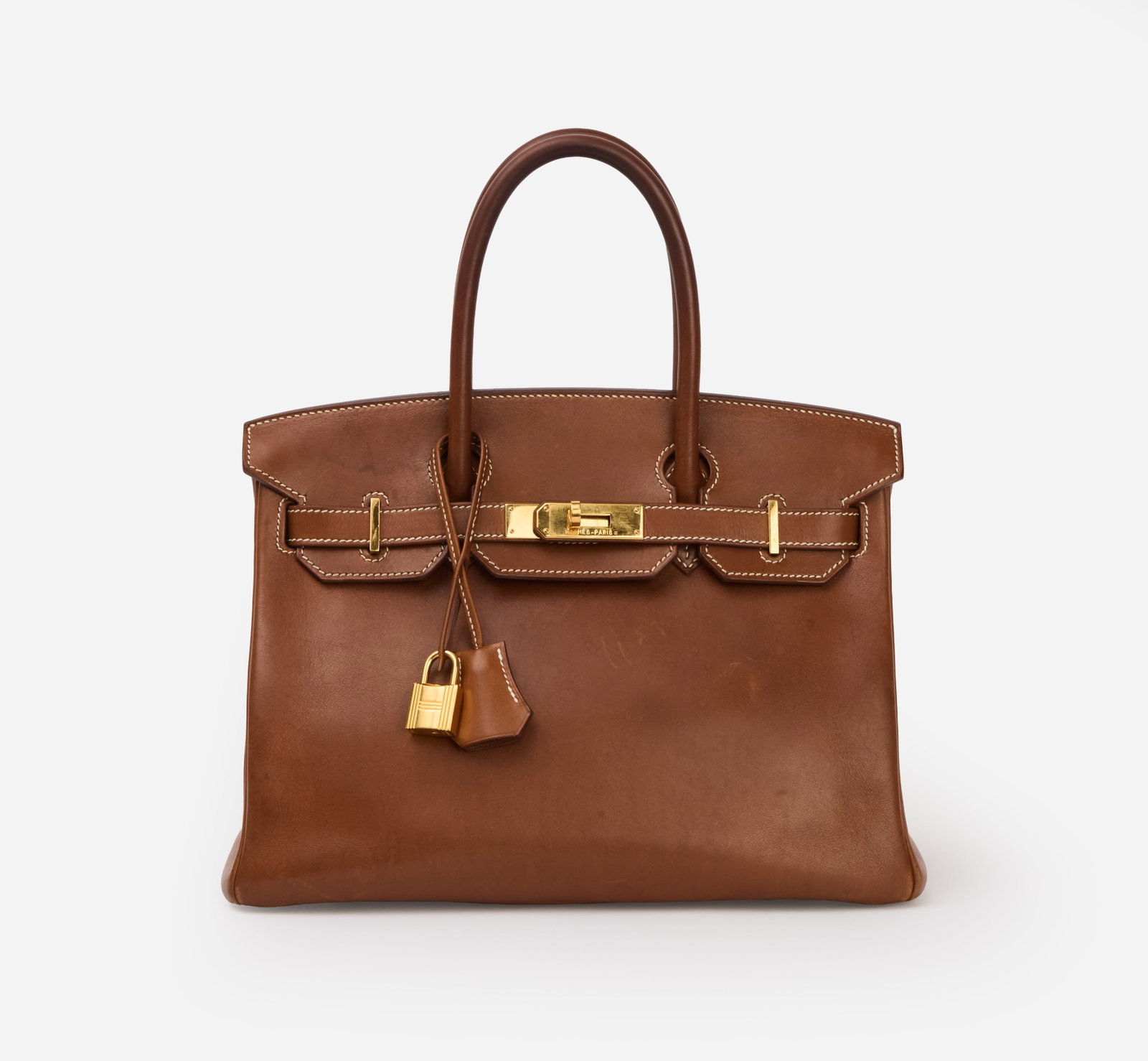 Hermès | Barenia Fauve 30 CM Birkin: An Hermès Barenia leather 30 cm, smooth calf leather, fauve, Birkin with gold hardware, lined with goat leather. The bag features contrasting saddle stitching in a white hue. The design