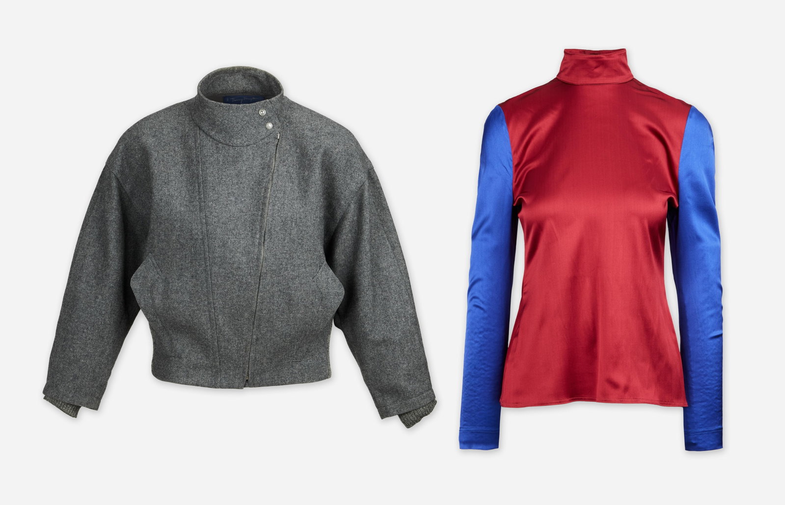 Thierry Mugler | Two Mugler Designs Cropped Wool Bomber Two-Tone Silk Blouse: A grouping of two Thierry Mugler designs: a cropped grey wool bomber jacket and the other is a bi-color long-sleeve silk top.The wool bomber is labeled Thierry Mugler Edition and has no marked size