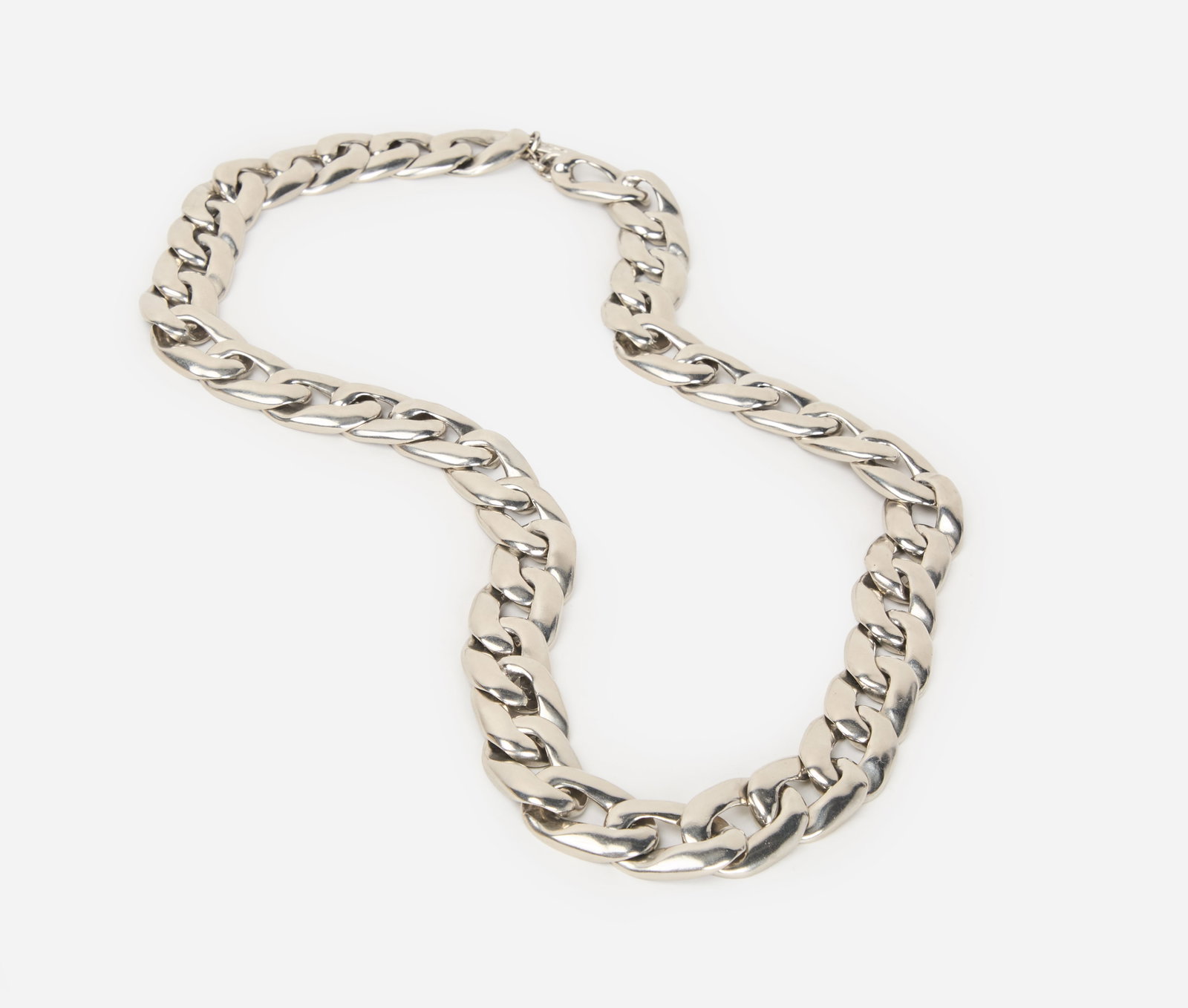 Yves Saint Laurent | Silver Curb Chain Necklace: An Yves Saint Laurent silver-tone curb chain necklace with a YSL makers mark, country of origin is France. The length of the necklace measures 15.25 inches.