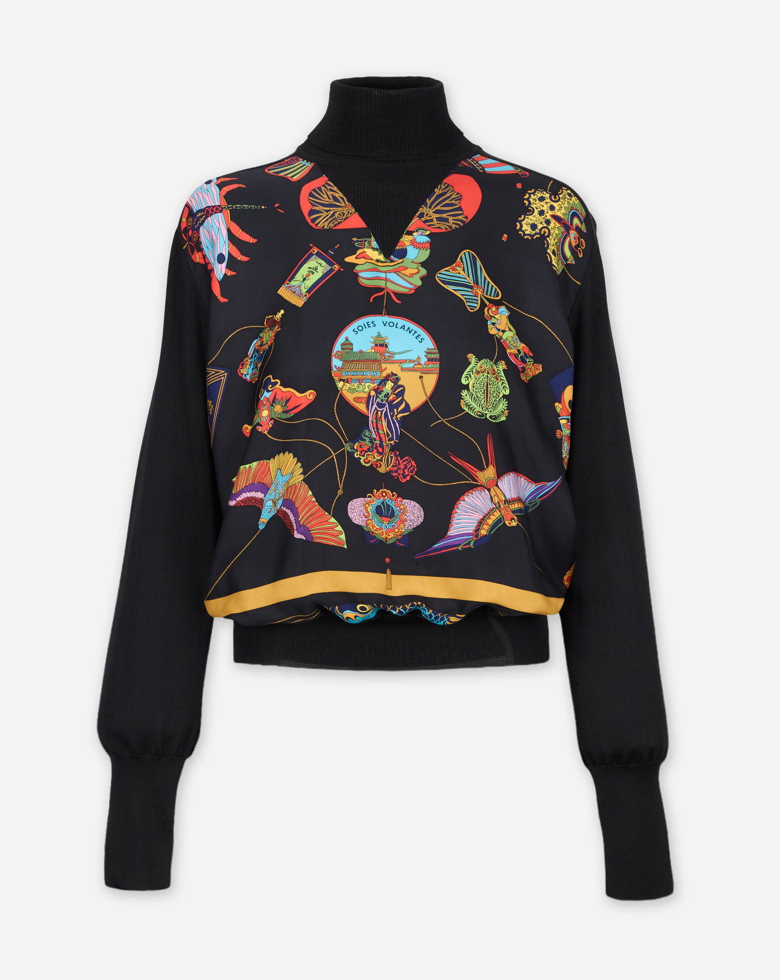 Hermès | Patterned Top: Hermès printed turtleneck top from the collection of Cameron Silver. The black long-sleeve sweater is composed of 100% silk featuring a high ribbed turtleneck, ribbed cuffs, and a ribbed hem. T