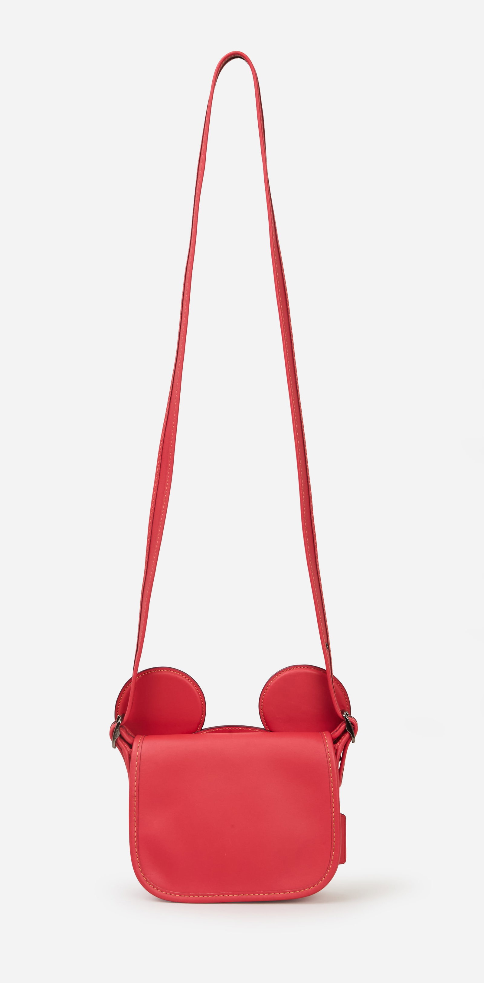Disney x Coach | 2017 Mickey Mouse Limited Edition Handbag: Disney x Coach Mickey Mouse limited edition handbag designed Stuart Vevers in 2017. The red leather shoulder bag features a flap front, rounded edges, and contrast stitching throughout. It is