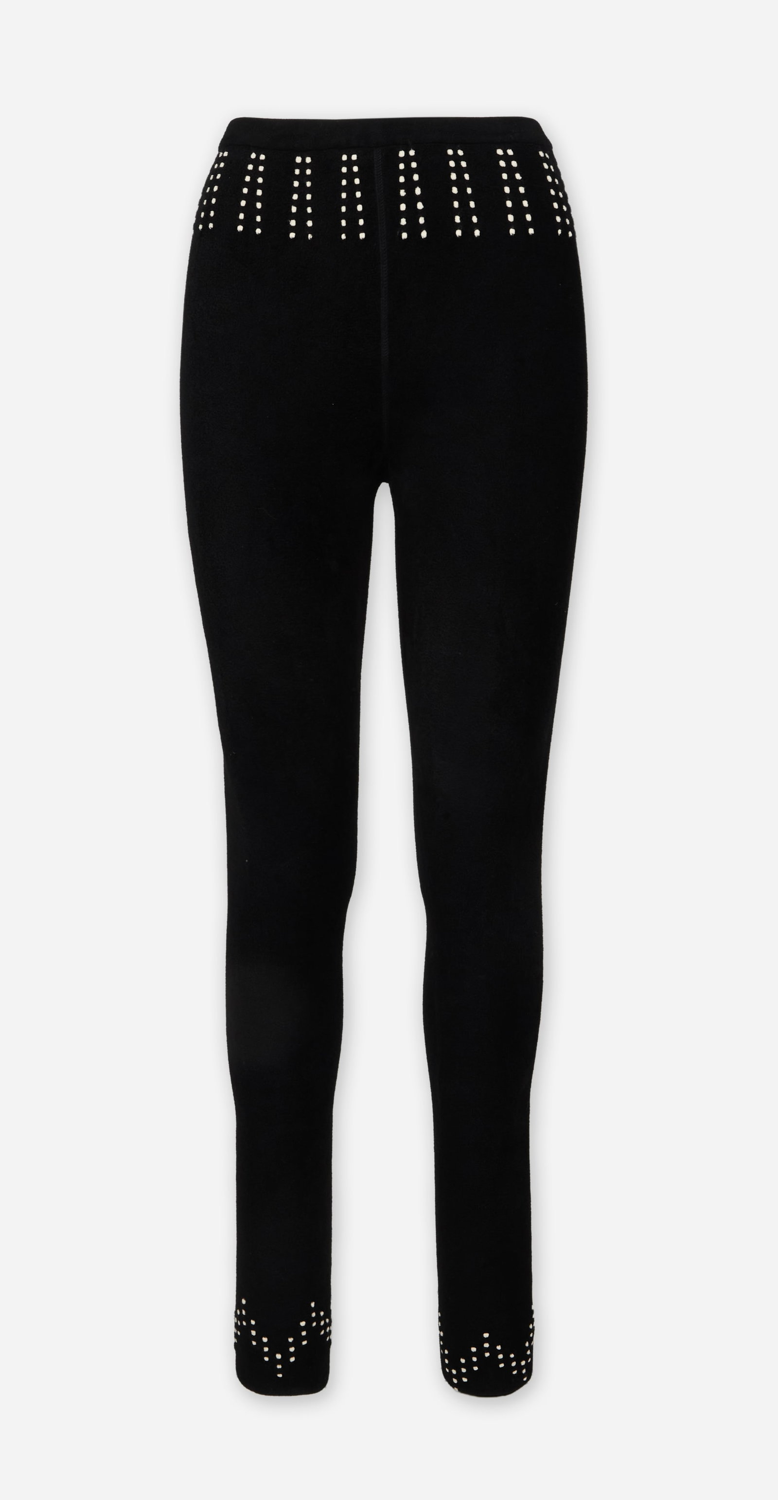 Alaïa | Black Leggings: Alaïa black leggings. The pants are composed of a polyester and wool blend and feature a high-rise elastic waistband. They are designed with a white polka dot print along the waistband and ankle