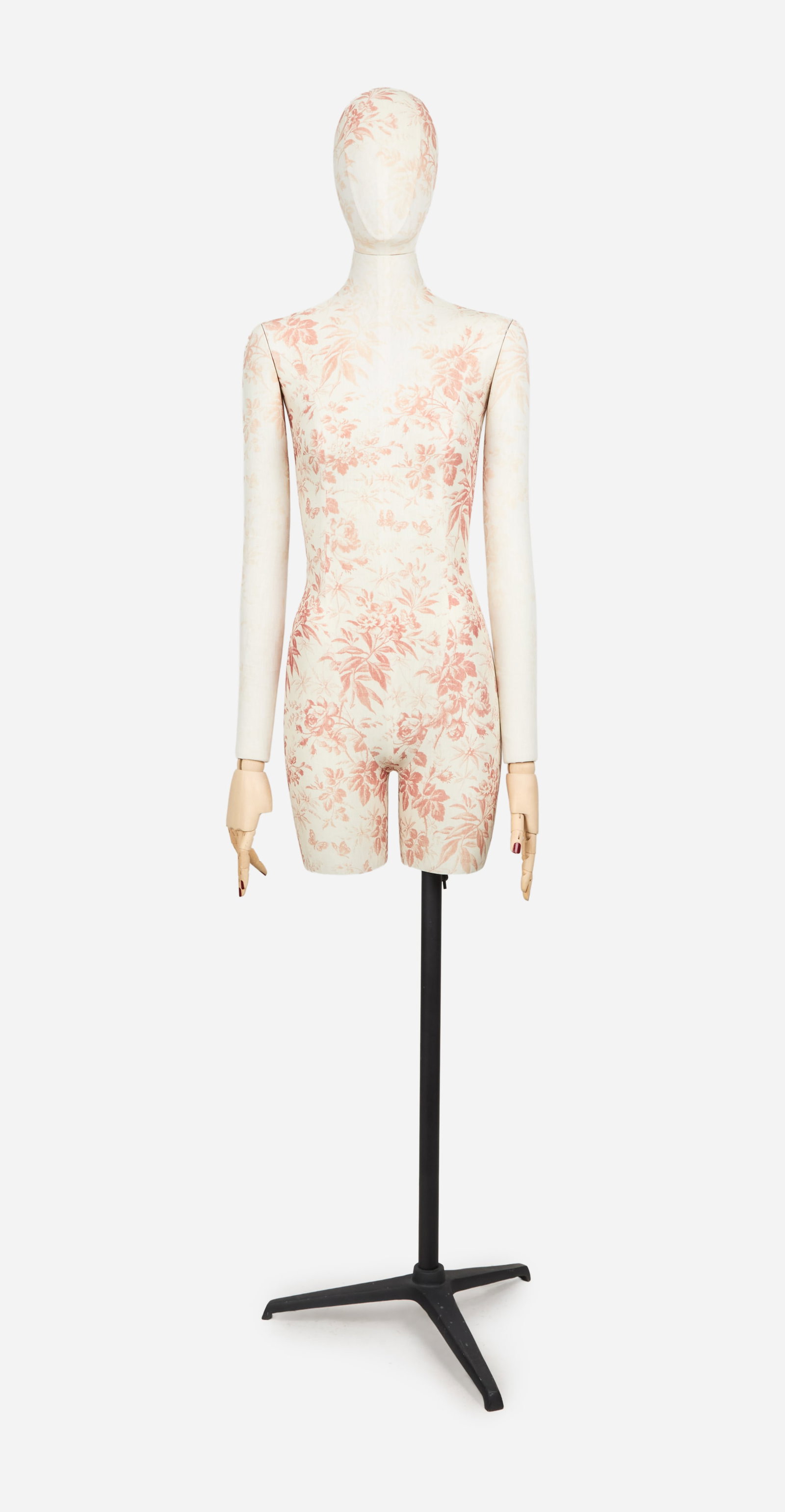 Gucci | 2016 Cruise Floral and Butterfly Textile-Covered Mannequin Form: A fiberglass head and upper body mannequin form covered in an ivory and pink flower and butterfly textile marked "Gucci" in script near the hip on the right-hand side of the form. The mannequin has