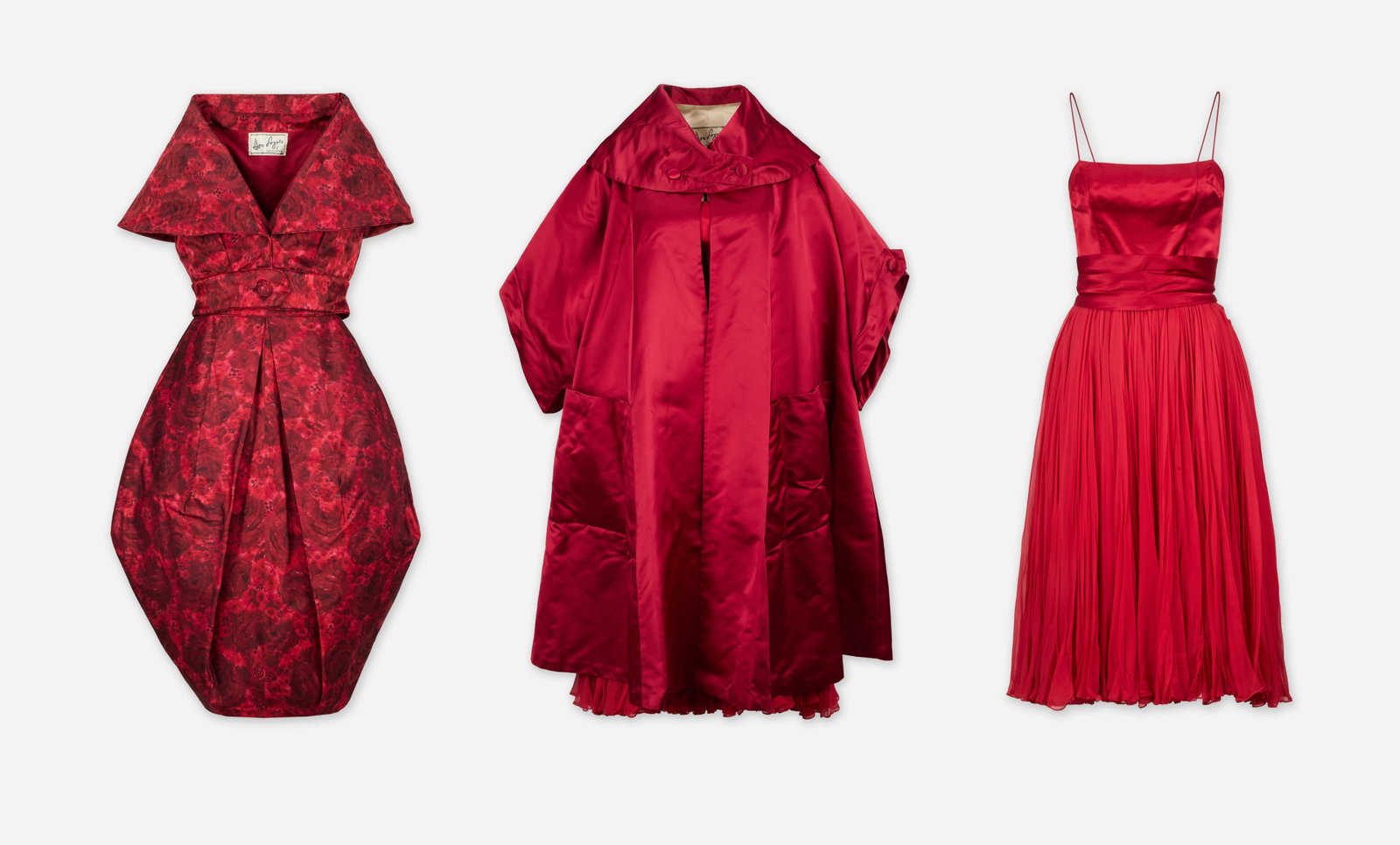 Don Loper | Two Satin Red Evening Cocktail Dresses and Coat: A group of two satin red evening cocktail dresses and a coat from Don Loper circa 1950s, owned by Silvia Fine Kaye, an lyricist, composer, and producer, married to comedian Danny Kaye. Silvia's work