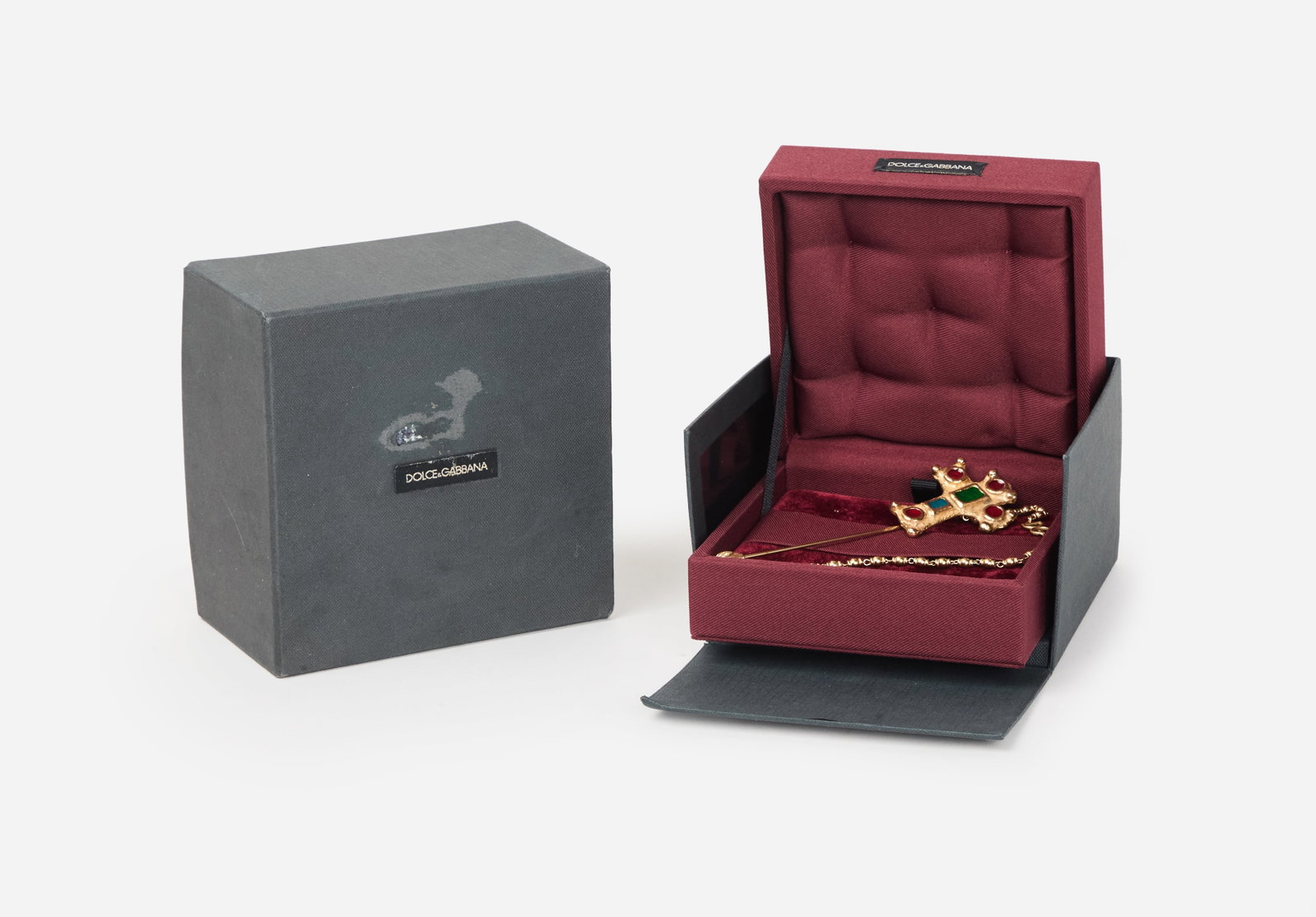 Dolce & Gabbana | Maltese Cross Stick Pin (With Box): A Dolce & Gabbana Maltese Cross stick pin with chain, comes with the original packaging. From the collection of Cameron Silver. Pin measures five inches top to bottom. Dolce & Gabbana was founded in