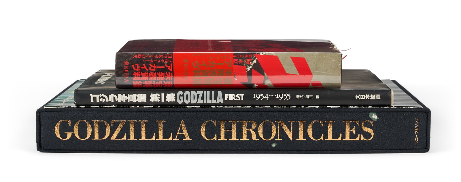 Godzilla | Books (3): A group of three books related to the long-running Godzilla franchise, which originated with Godzilla (Toho, 1954), including: KISHIKAWA, OSAMU. Godzilla First: 1954-1955. Tokyo: Toho Publications,