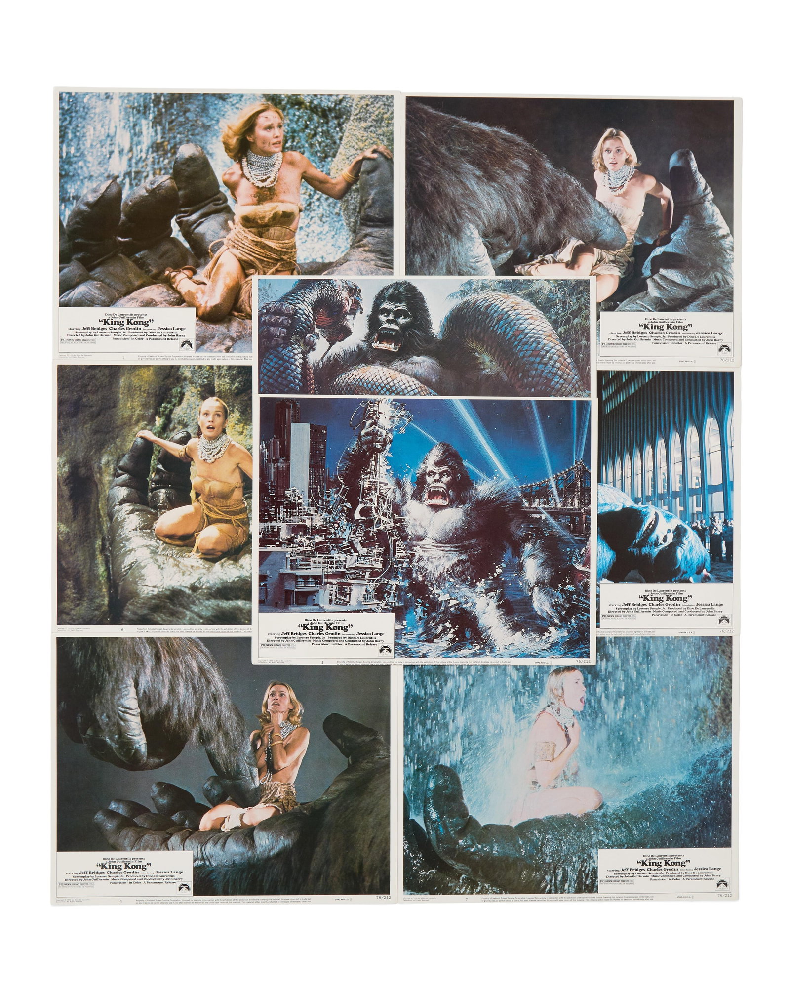 King Kong (1976) | Lobby Cards (8): A collection of eight lobby cards for the big-budgeted remake of King Kong (Paramount Pictures, 1976). Five feature images of Jessica Lange (in her debut film performance) in the hands of the giant