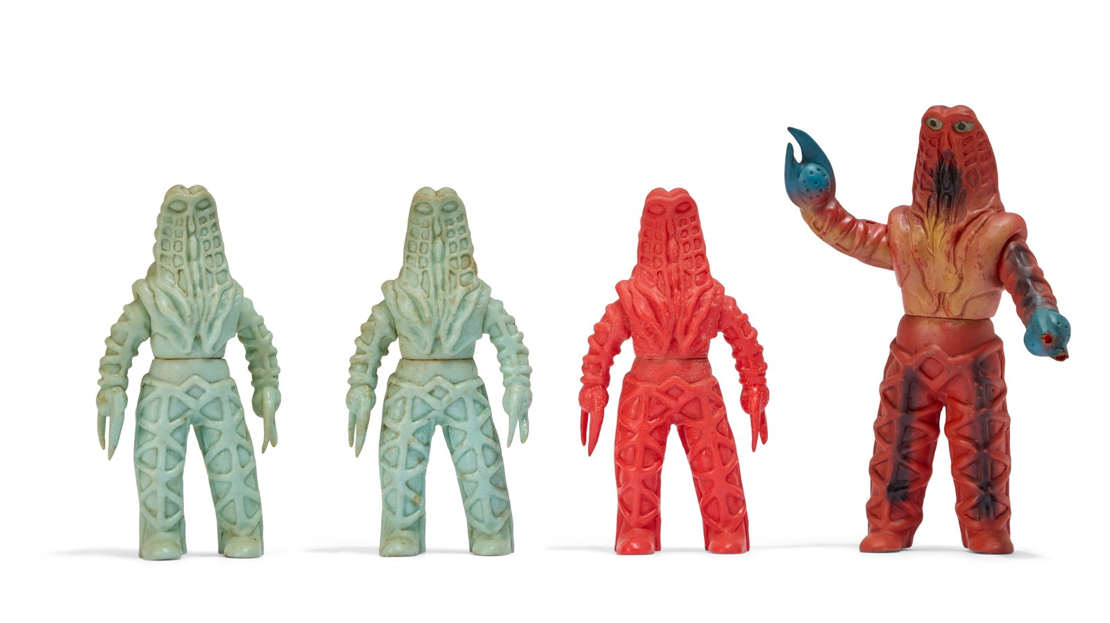 Sofubi | Vintage Godora Kaiju Figures (4): A group of four vintage Godora Kaiju figures, including one Bullmark figure. Please note: one of the hands on the multi-colored figurine has a broken claw. From the Estate of Sompote Sands