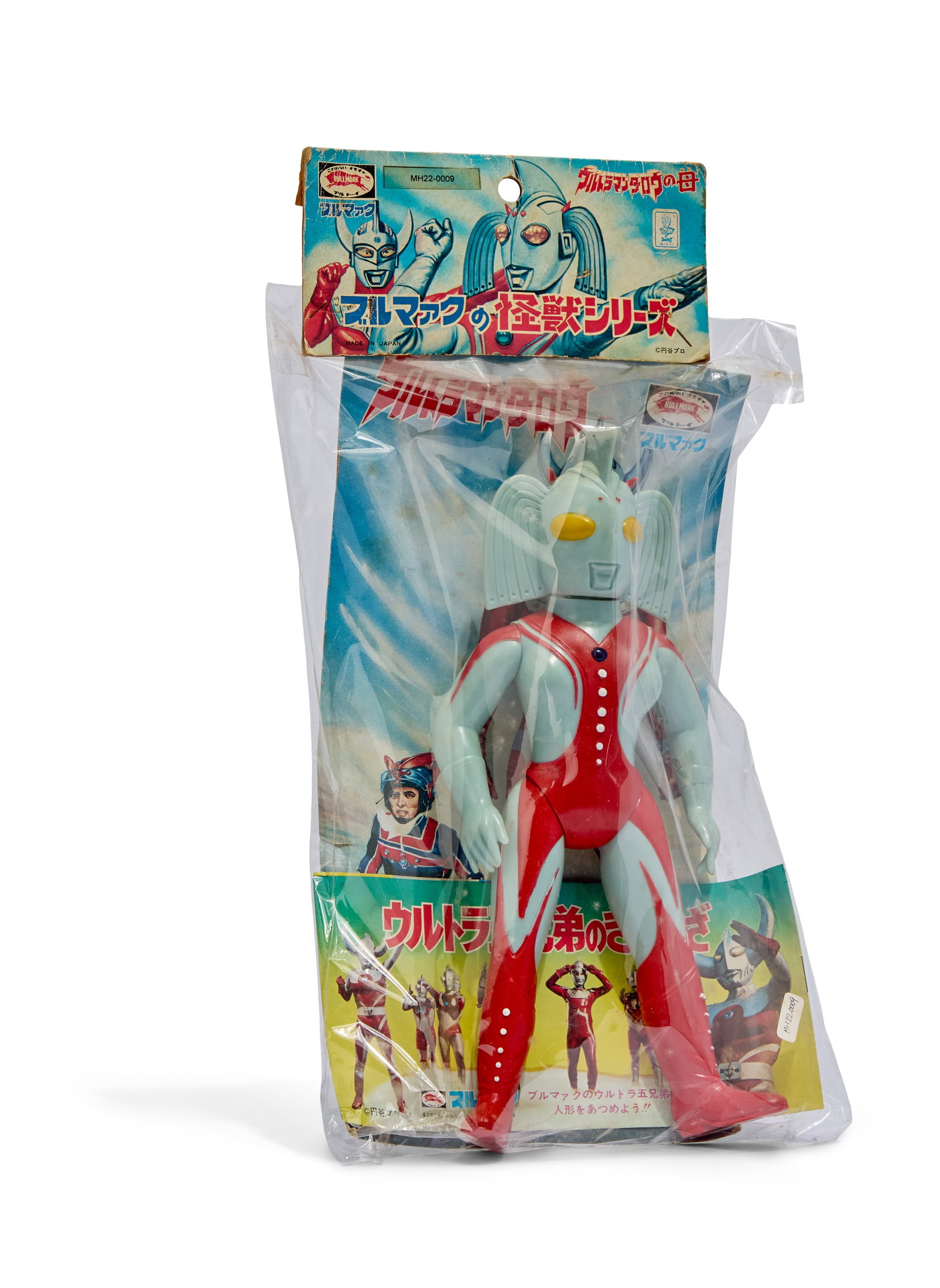 Sofubi | Vintage Mother of Ultra Figure with Original Packaging Elements: A vintage Mother of Ultra vinyl figure with elements of original Bullmark packaging. This includes the header, which has evidence of having been opened and re-stapled at some point. Plastic most