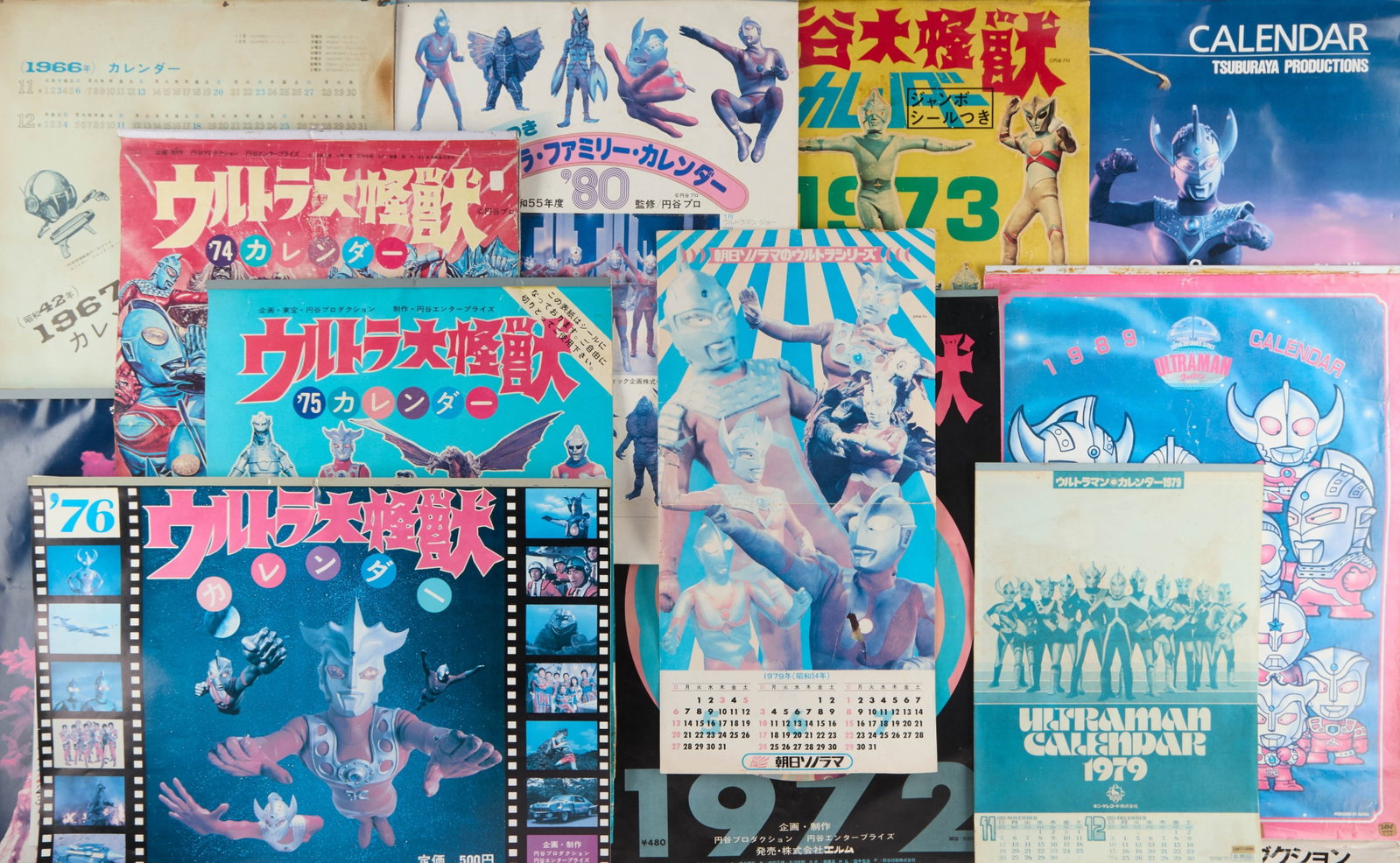 Ultraman | Vintage Calendars (13): Thirteen vintage calendars for the Ultraman franchise from the 1960s and 1970s. Please note the calendars are heavily damaged. The back pages of most of the calendars have been torn out and are