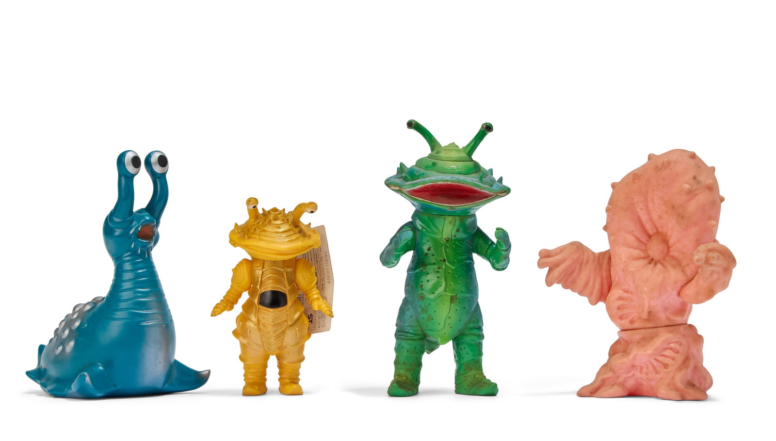 Sofubi | Vintage Kaiju Figures (4): A group of four vintage Kaiju figures, including Greenmons (M1), Kanegon (Marusan), Kanegon (Bandai), and Namegon (Billiken). From the Estate of Sompote Sands