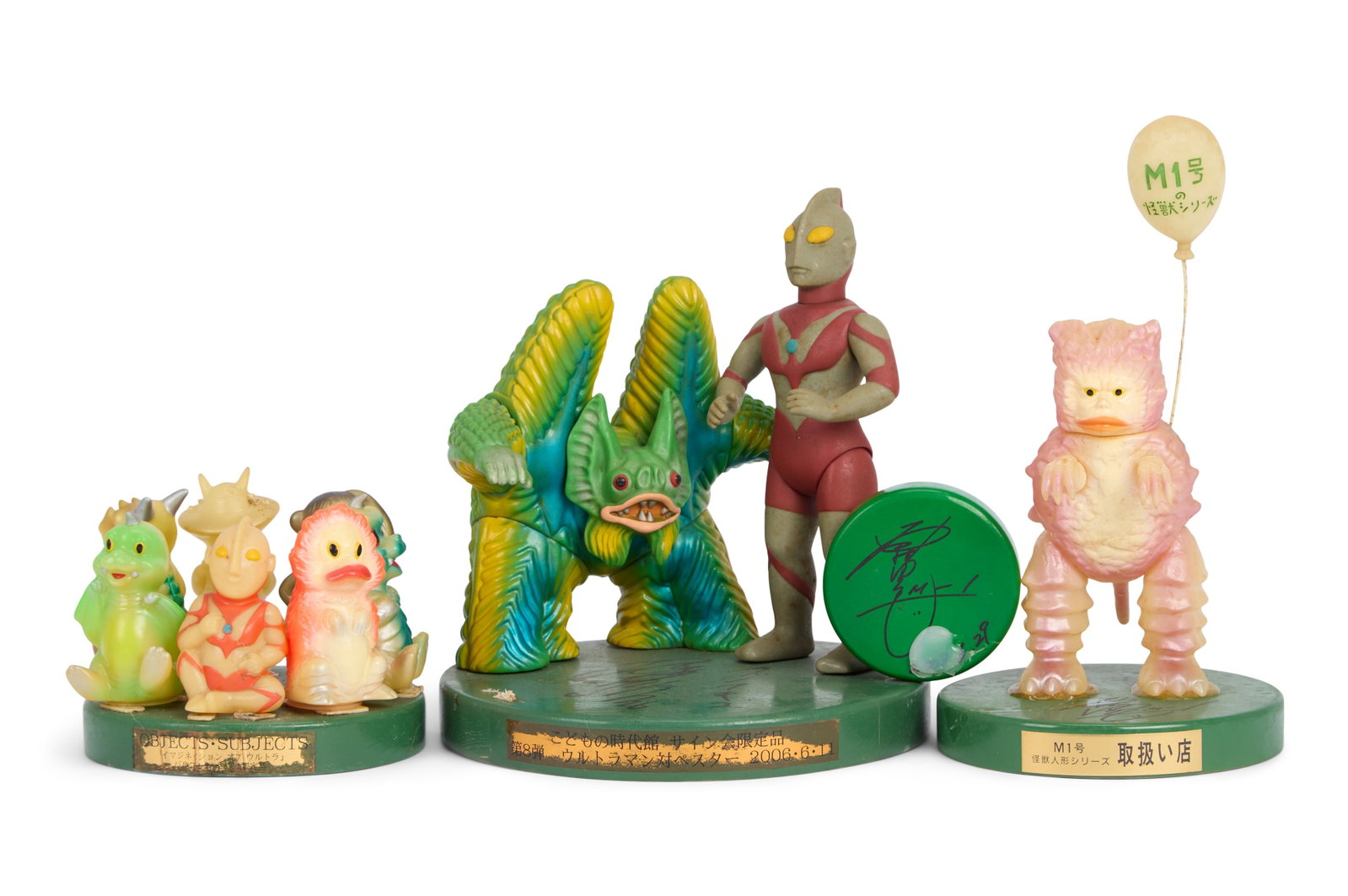 Sofubi | Vintage Figures with Signed Pedestals (4): Vintage sofubi figures of Ultraman and kaiju characters, each presented on a display pedestal featuring original signatures. Includes: -Ultraman vs. Pestar Showdown Set with Hiroko Sakurai's signature