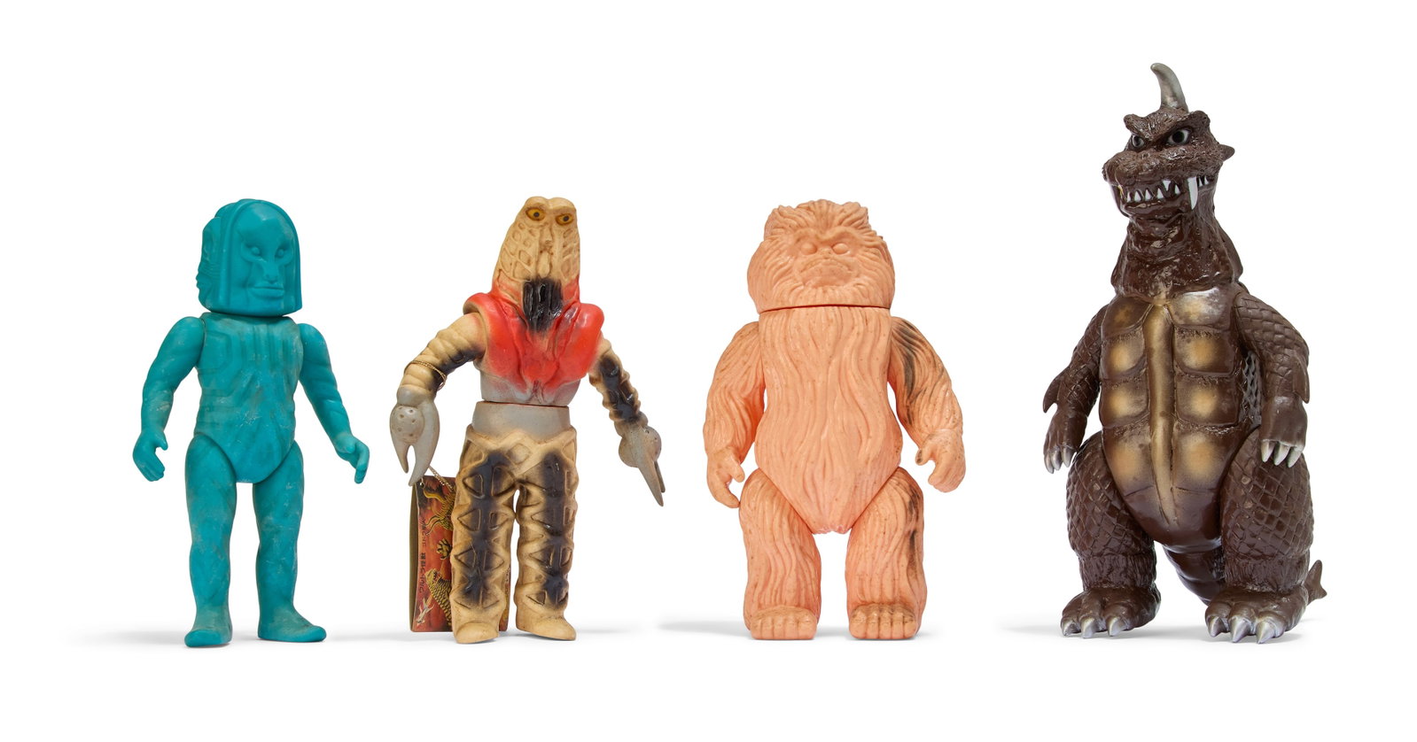 Sofubi | Vintage Kaiju Figures (4): A group of four vintage Kaiju figures, including Dada (M1), Godra (Bandai Bullmark), Woo (M1), and Gomess (Marmit). From the Estate of Sompote Sands
