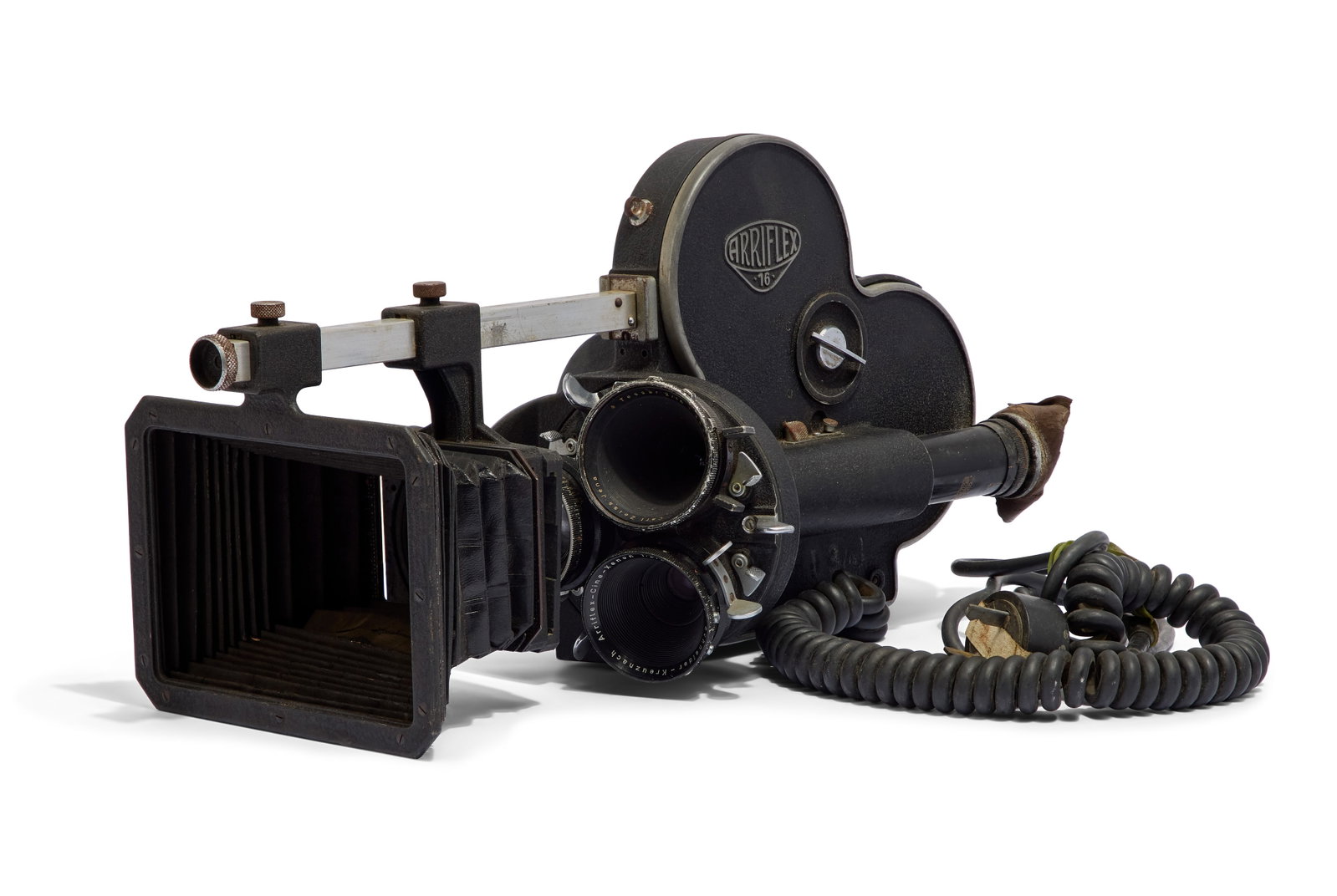 Arriflex | 16mm Motion Picture Camera: A black and silver-tone Arriflex 16 ST motion picture camera, owned by Thai filmmaker Sompote Sands. Includes a bellows matte box with beam, magazine, original power cord, and a three-lens turret.