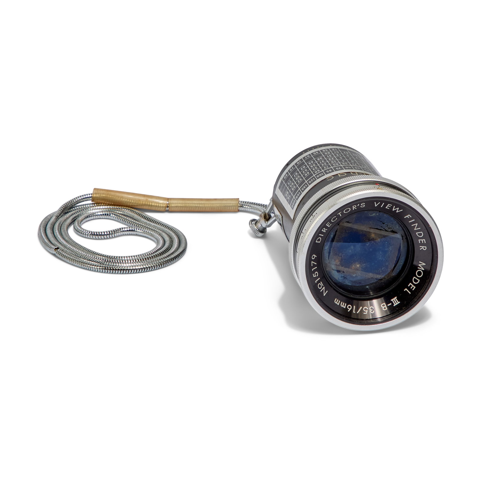 Sun-nac | Model III-B Director's Viewfinder: A vintage Sun-nac viewfinder on a chain. Believed to have been filmmaker Sompote Sands' personal viewfinder. Model III-B 35/16 mm, No. 15179 Director's View Finder, lens made in Japan. From the