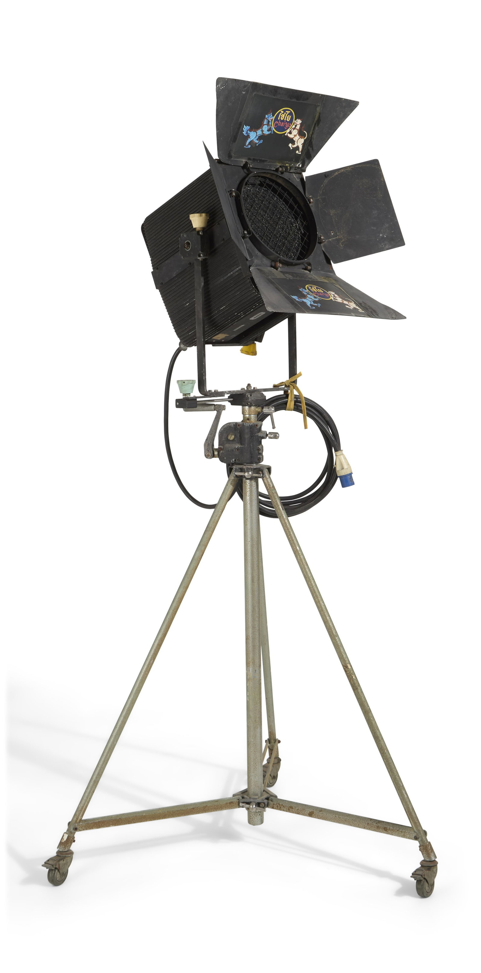 ADB | Chaiyo Productions Studio Light: An ADB studio light, circa 1960s, on a mobile stand with wheels. Used by Chaiyo Productions and featuring the studio's logo on the top and bottom inner light flaps. Serial number 1020.24.010; type