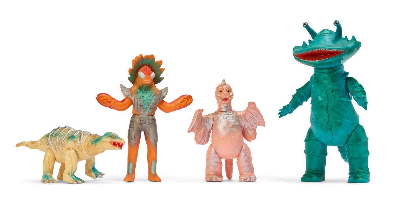 Sofubi | Vintage Bandai Kaiju Figures (4): A group of four vintage Bandai Bullmark Kaiju figures, including Kanegon, Stegon, Peguila, and Guironian. From the Estate of Sompote Sands