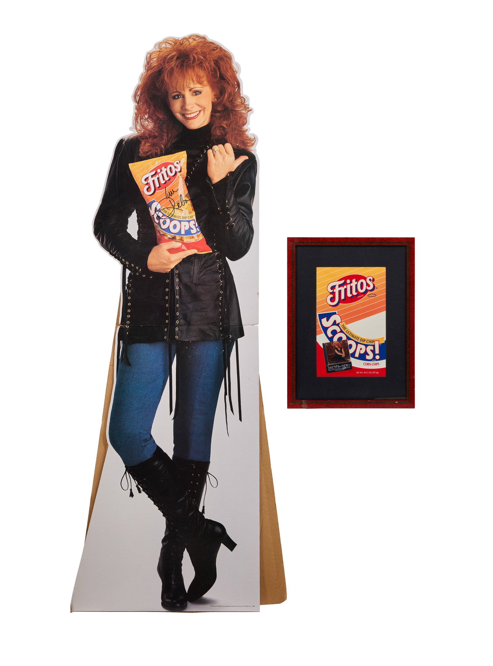 Reba McEntire | Signed Fritos Standee with Framed Promo: A Fritos standee of Reba McEntire, signed by her in black marker. Together with a framed Fritos graphic and Ford promotional clipping which reads: "Save $2 on Reba's new CD or $1 on cassette when you 