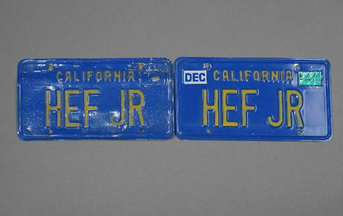 PLAYBOY: Hugh Hefner Owned License Plates: Two California license plates, 6 by 12 inches, December 1996, reading: "HEF JR," very light wear, overall excellent condition.These plates were used to make Hefner's Playboy Mansion golf cart street