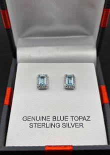 Sterling Silver Blue Topaz Earrings: SUN 925 Silver earrings with Blue Topaz gemstone, see photos for condition and details. New in Box