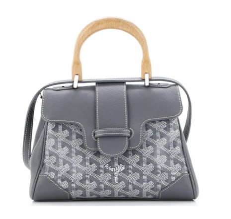 Goyard Saigon Top Handle Bag Coated Canvas with Leather Mini: Goyard Saigon MM Bag – Gray Goyardine Canvas with Leather Trim Make a sophisticated statement with this Goyard Saigon MM Bag. Combining the house’s signature Goyardine canvas with luxurious leathe