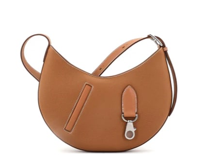 Hermes Arcon Bag Togo and Swift Petite: Hermès In-the-Loop 23 Bag – Gold Clemence Leather with Palladium Hardware Make a modern yet timeless statement with this Hermès In-the-Loop 23 bag. Inspired by the brand’s iconic Chaîne d’Anc