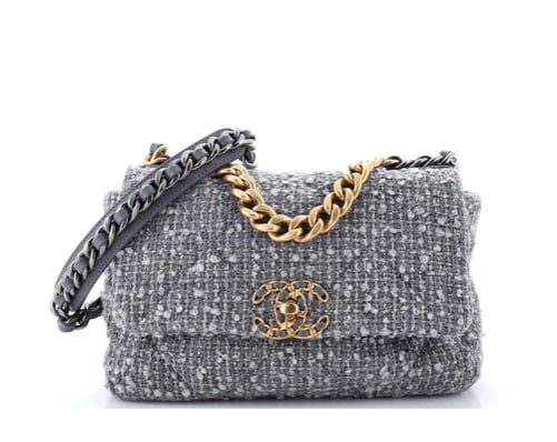 Chanel 19 Flap Bag Quilted Tweed Medium: Chanel 19 Flap Bag – Gray Tweed with Mixed Hardware Add a touch of modern elegance to your collection with this Chanel 19 Flap Bag. Designed with soft gray tweed and Chanel’s signature oversized