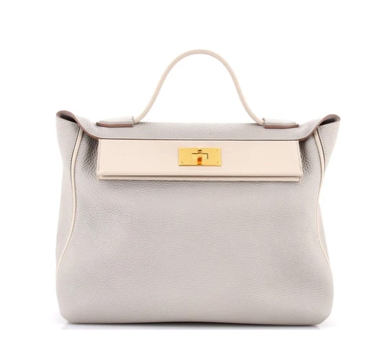 Hermes 24/24 Bag Togo with Swift 35: Hermès Jypsière 34 – Gris Mouette Clemence Leather with Gold Hardware Showcase effortless sophistication with this Hermès Jypsière 34. Crafted from luxurious Clemence leather in a chic Gris