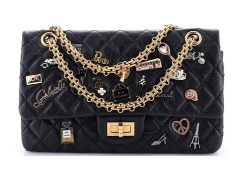 Chanel Lucky Charms Reissue 2.55 Flap Bag Quilted Aged Calfskin 225: Chanel 2.55 Reissue Flap Bag – Black Quilted Leather with Charms Celebrate the spirit of Chanel with this Chanel 2.55 Reissue Flap Bag. Crafted from luxurious black quilted leather, this statement